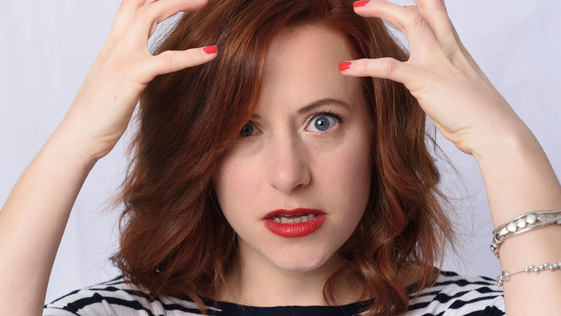 woman in black and white striped long sleeve shirt