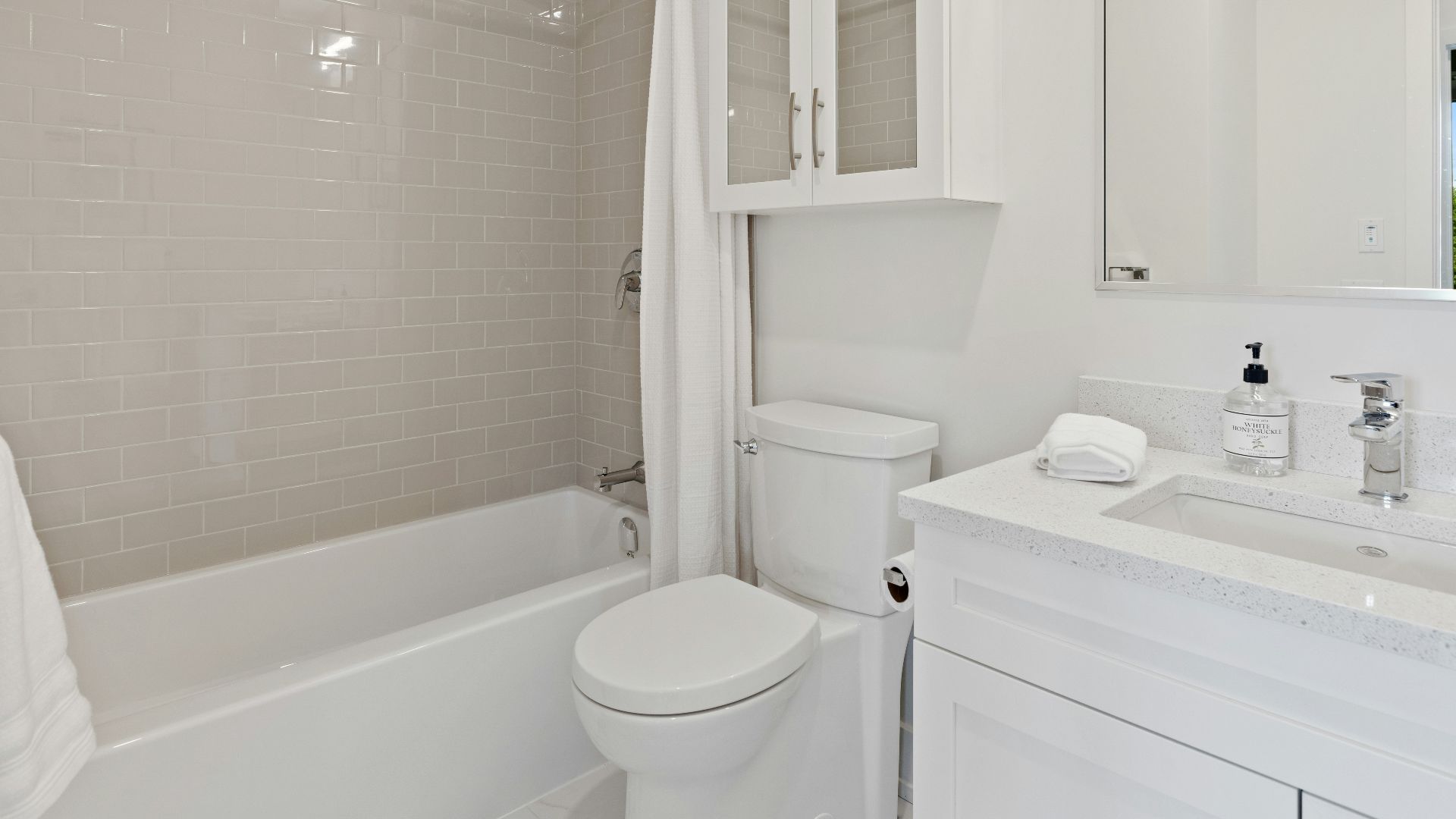white ceramic bathtub near white ceramic bathtub