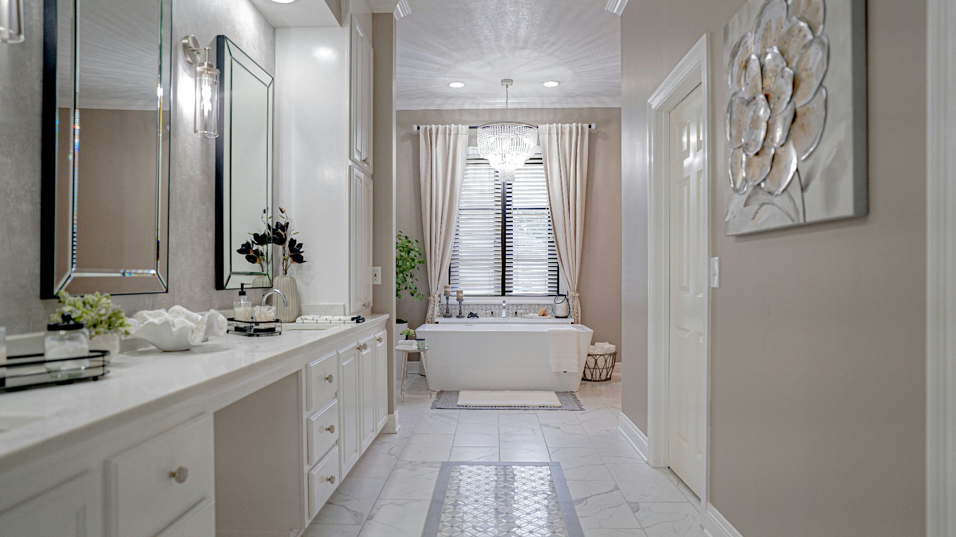 a bathroom with a tub, sink, and mirror