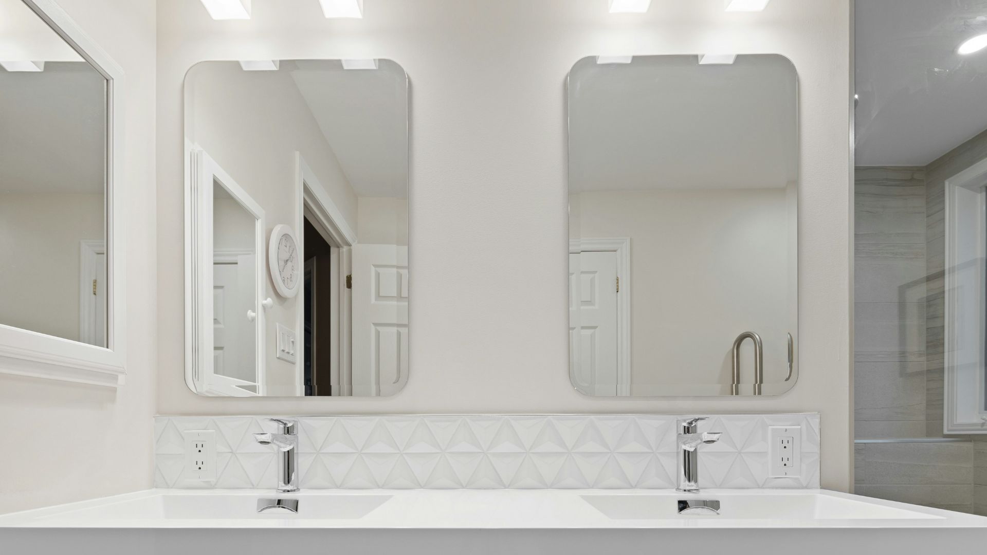 a bathroom with a couple of mirrors