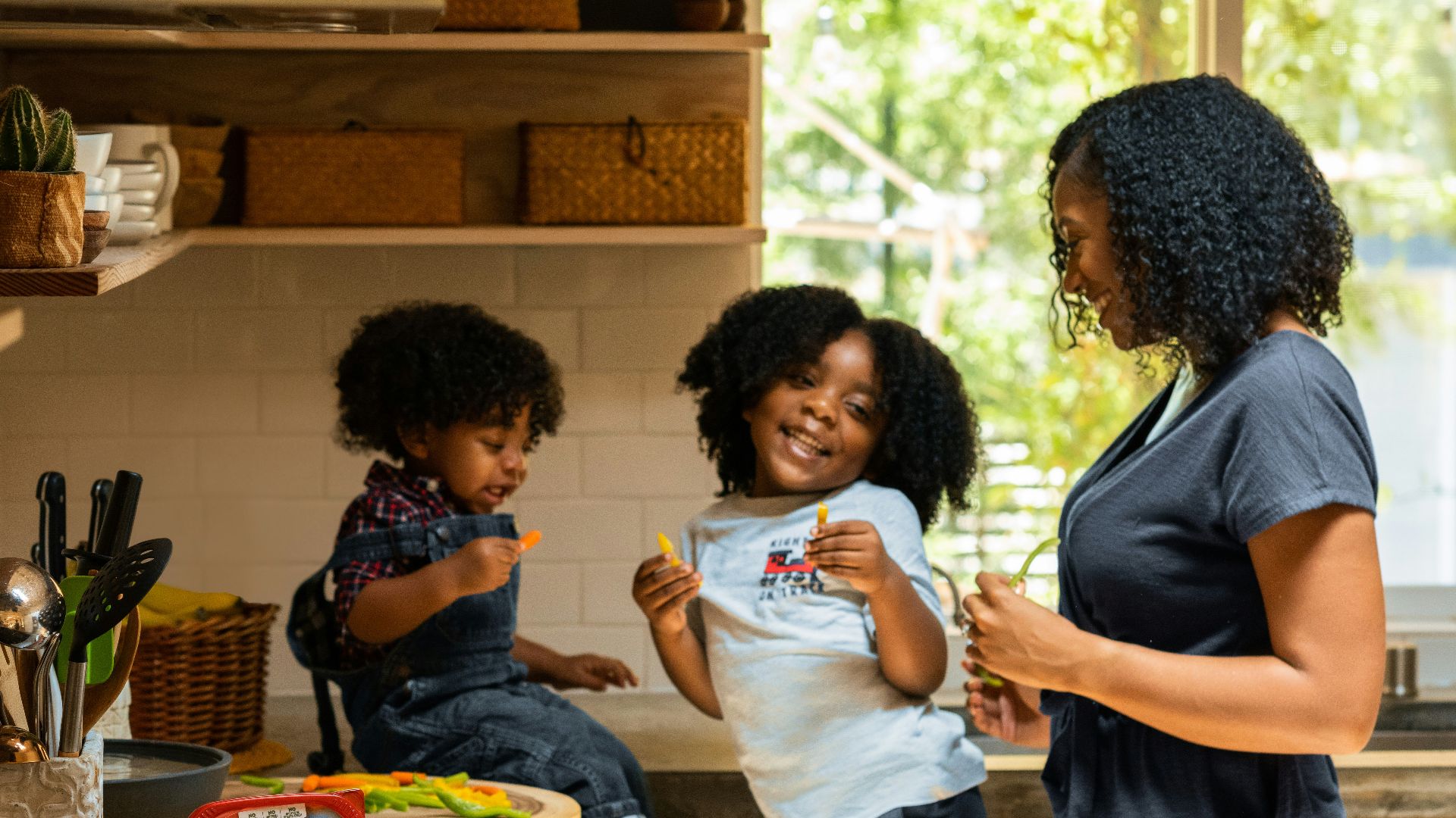 woman in white t-shirt standing beside woman in black and white stripe shirt