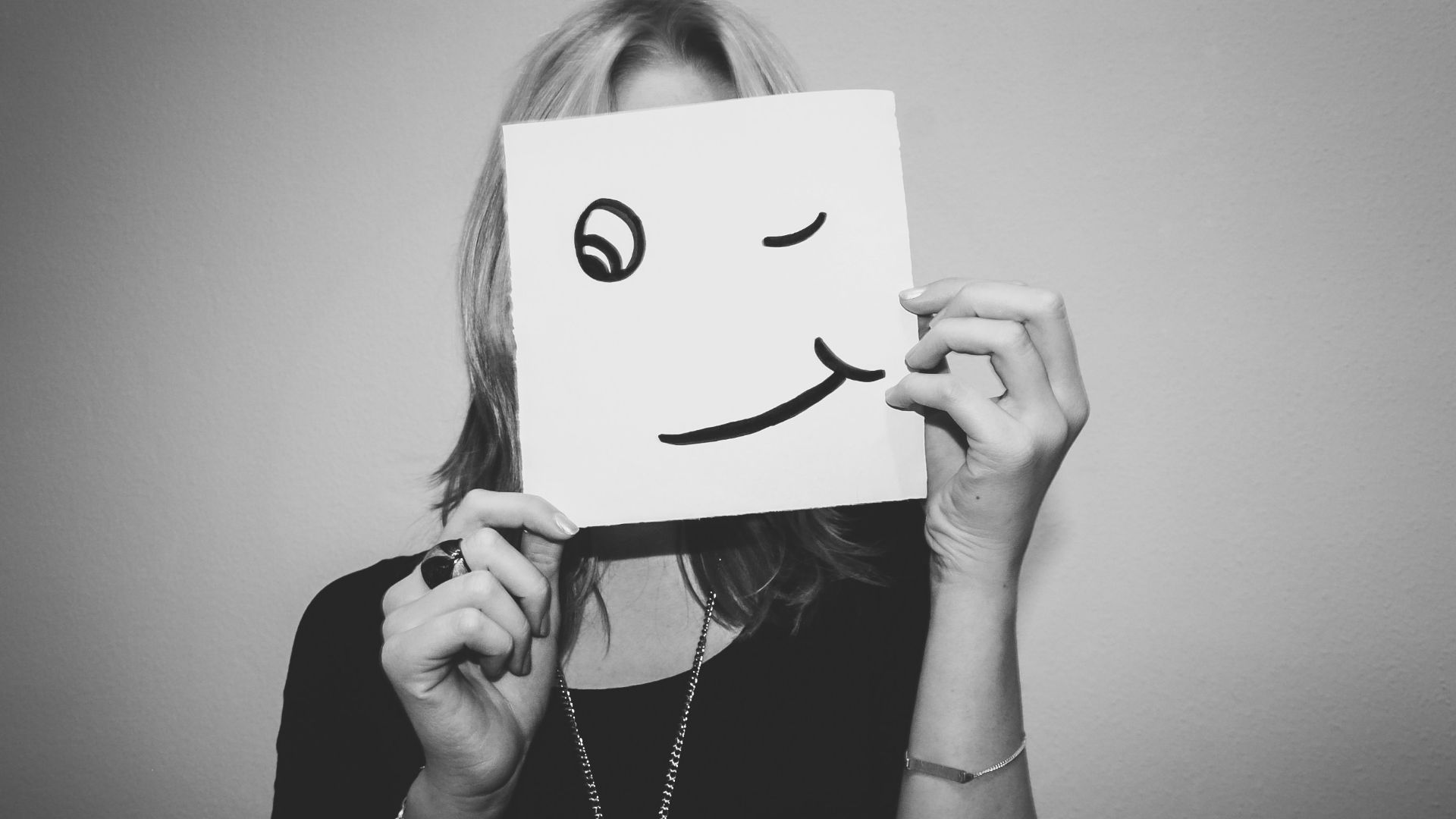 woman holding white printer paper