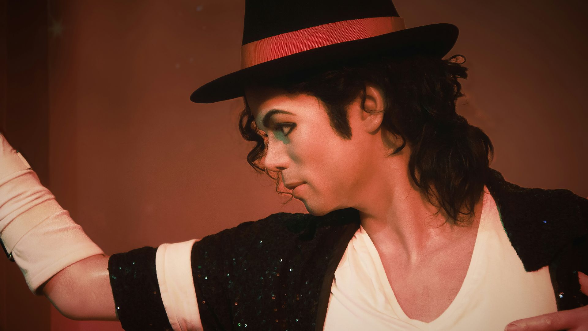 a man in a top hat and black jacket