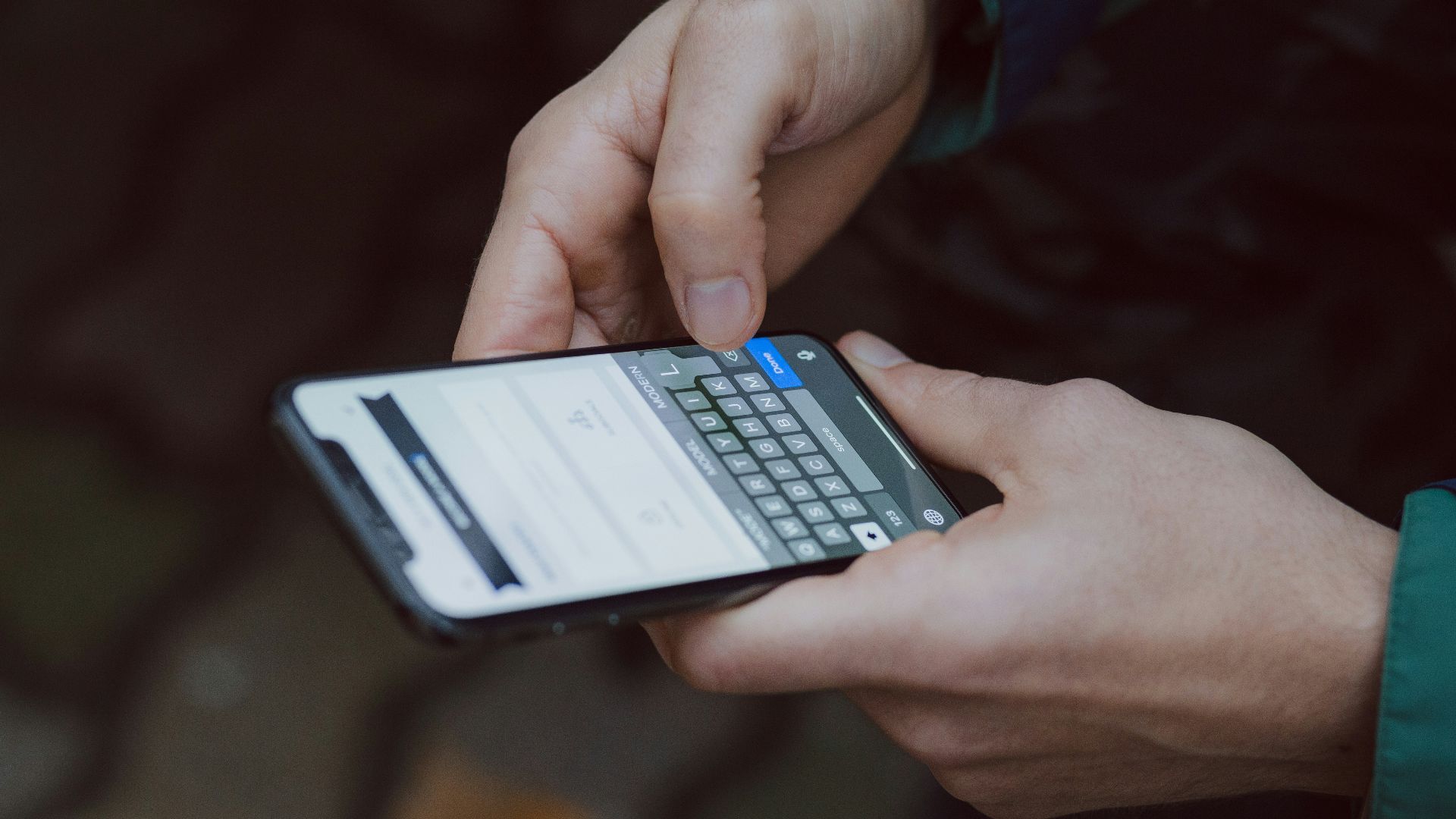 selective focus photography of person using smartphone