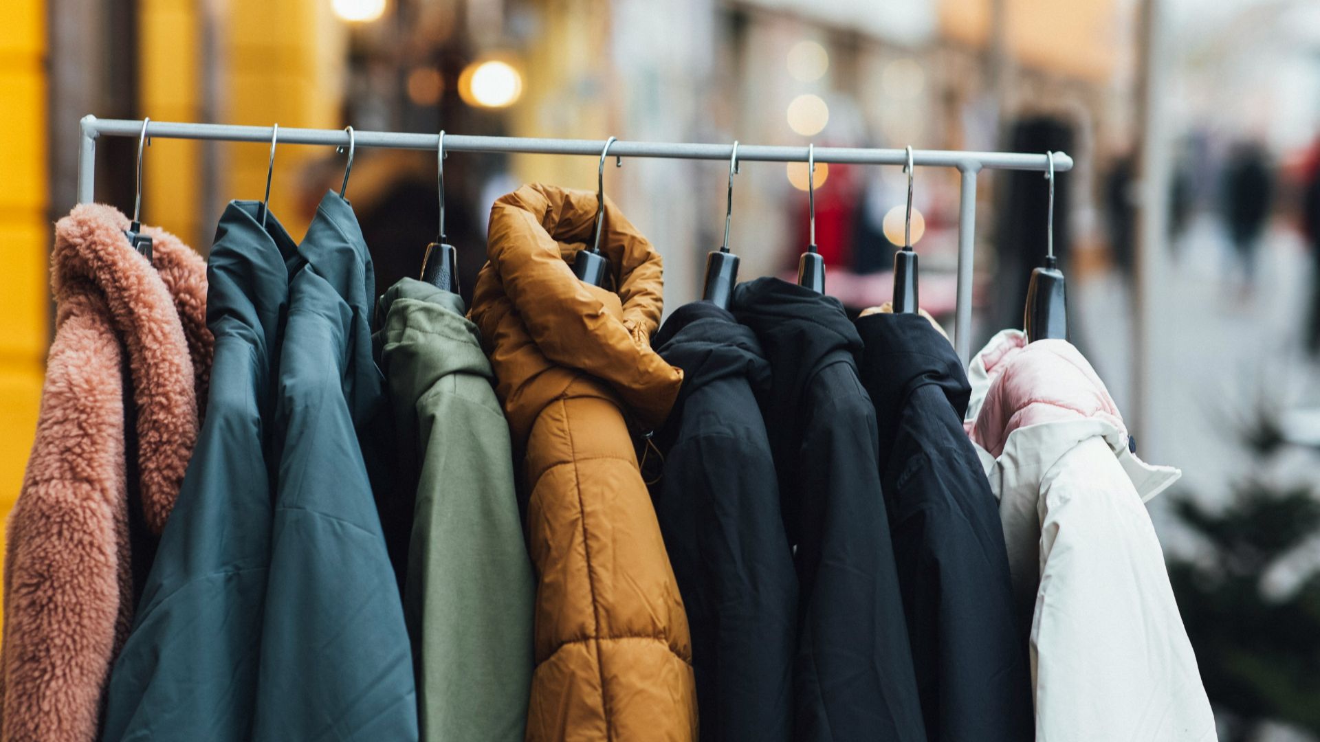 a rack of clothes hanging on a rail