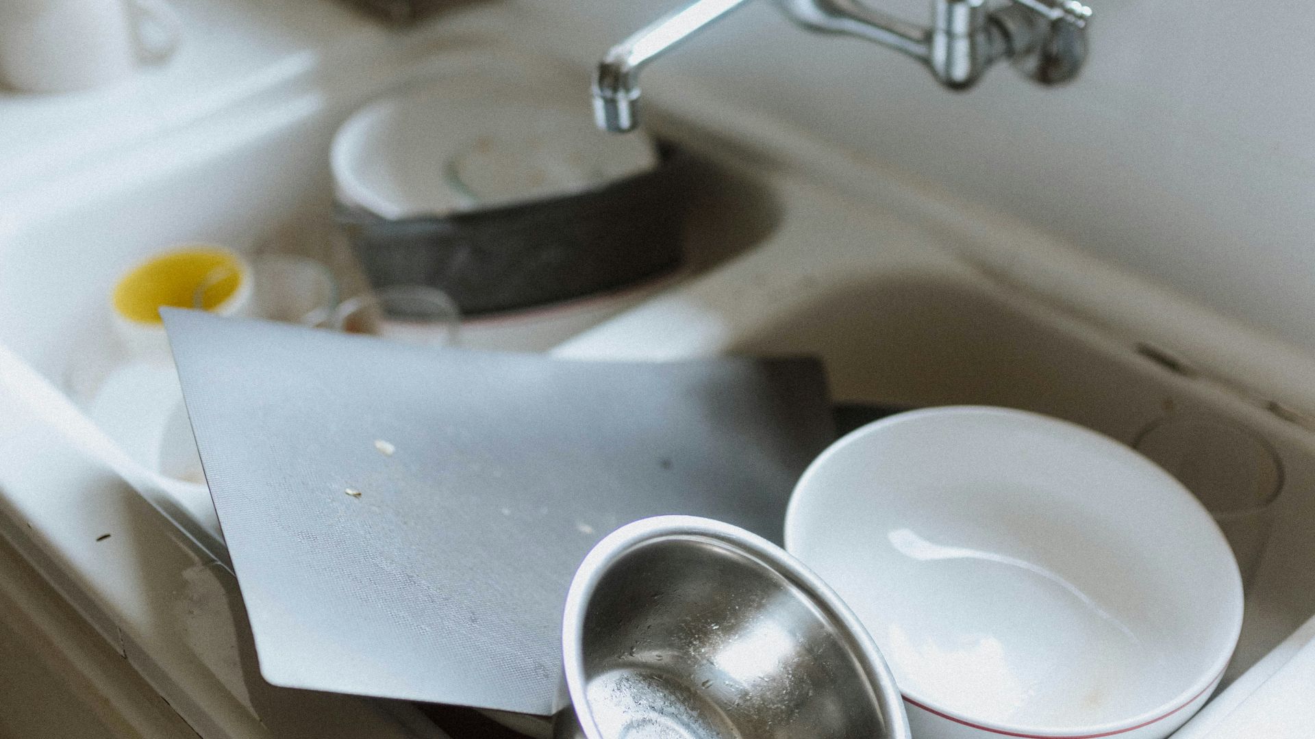 a sink with a couple of dishes on it