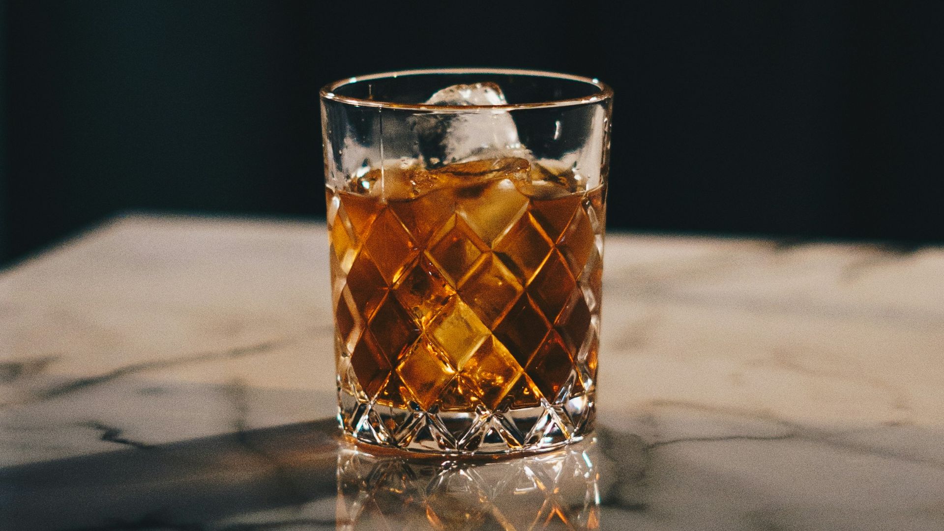 clear drinking glass with yellow liquid