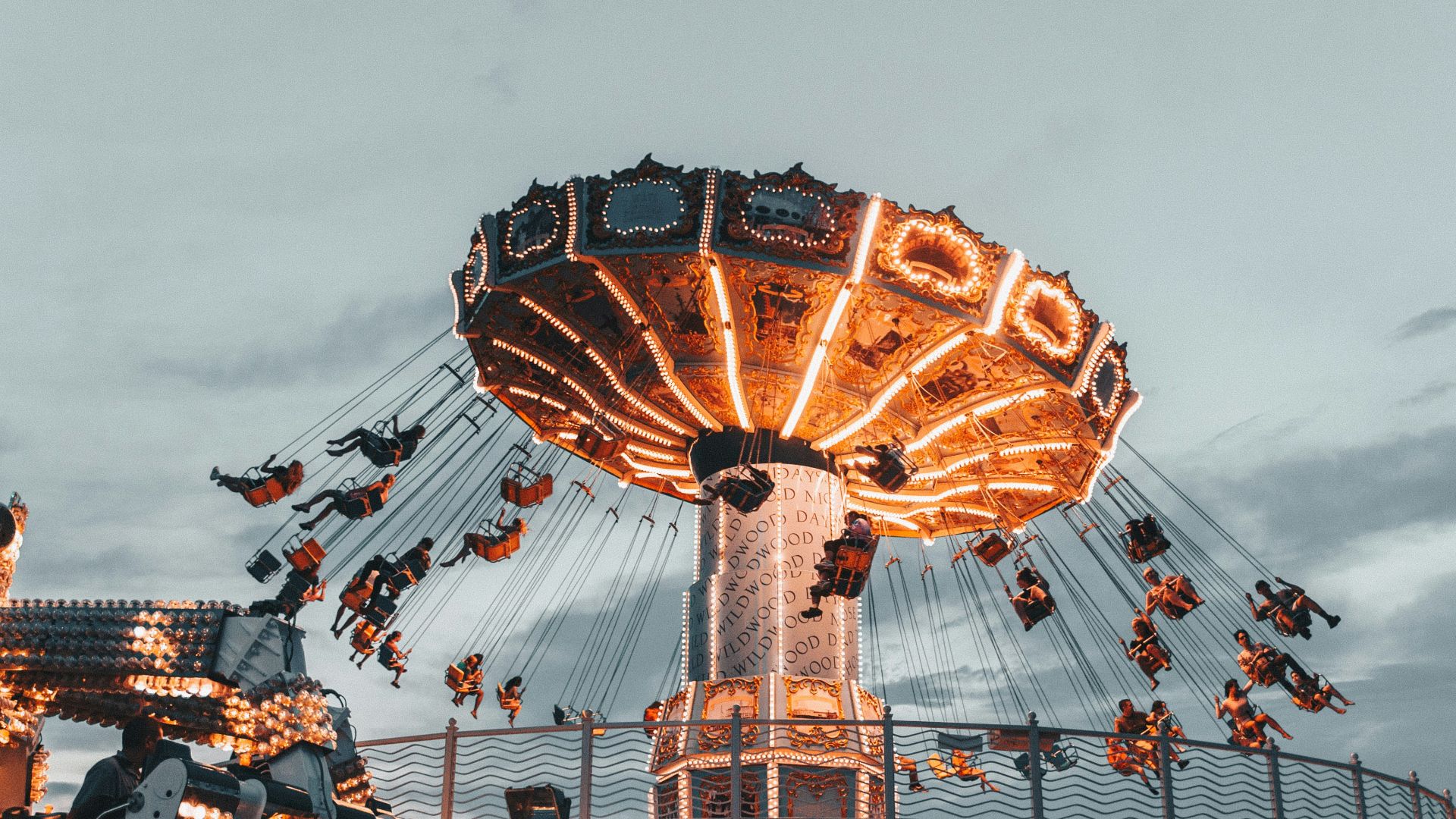 people riding amusement park ride