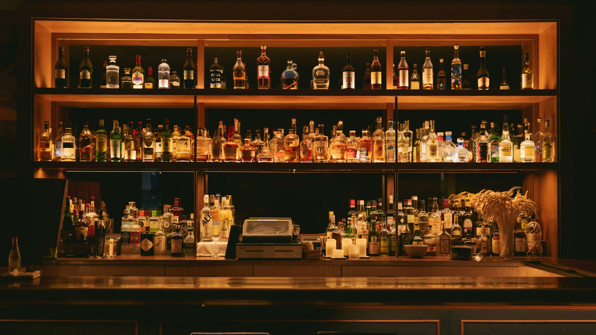 brown wooden shelf with bottles