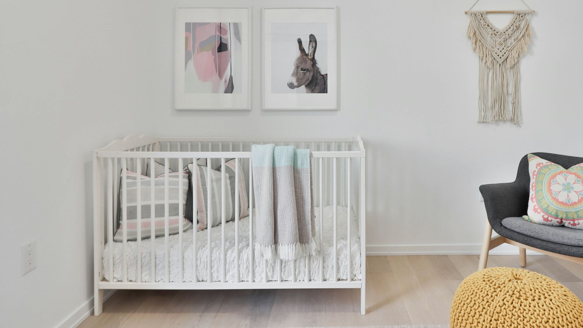 a bedroom with a bed and a chair in a room