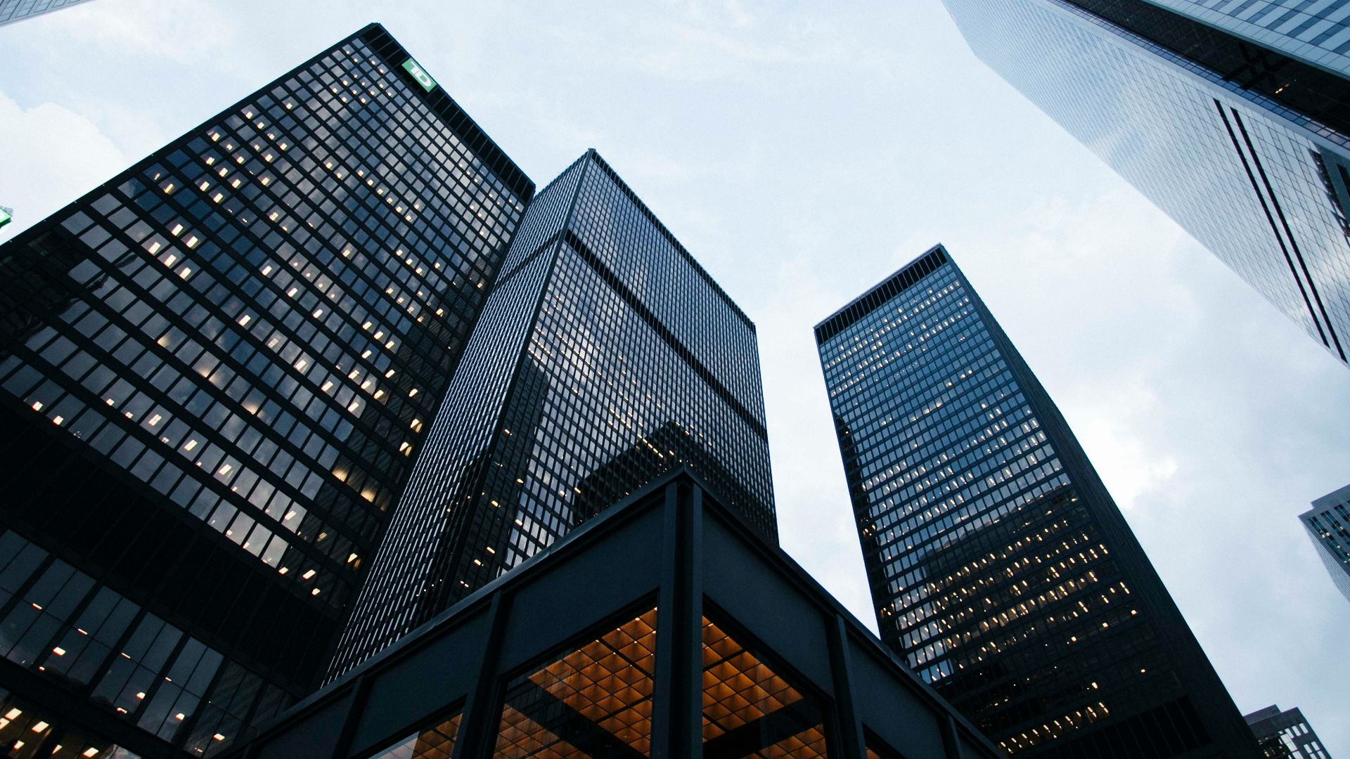 low angle photo of city high rise buildings during daytime