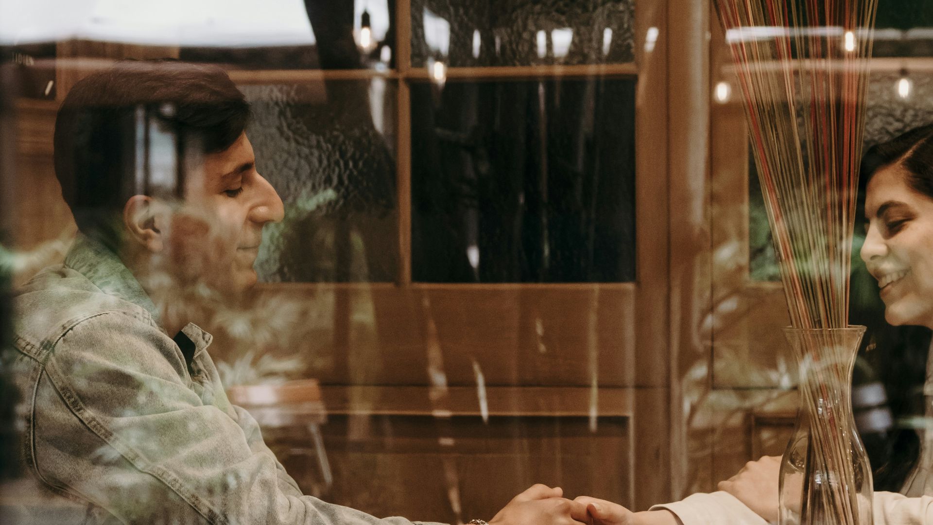 a man and a woman sitting at a table