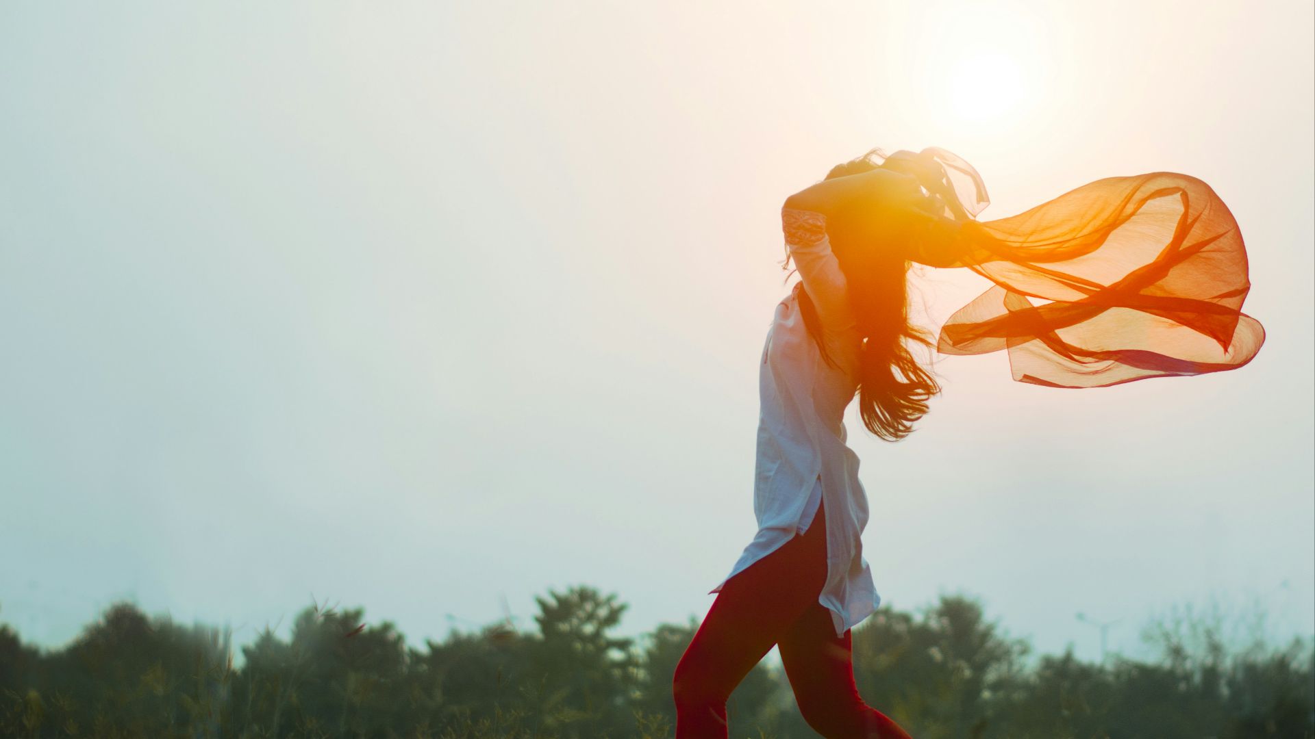 woman spreading hair at during sunset