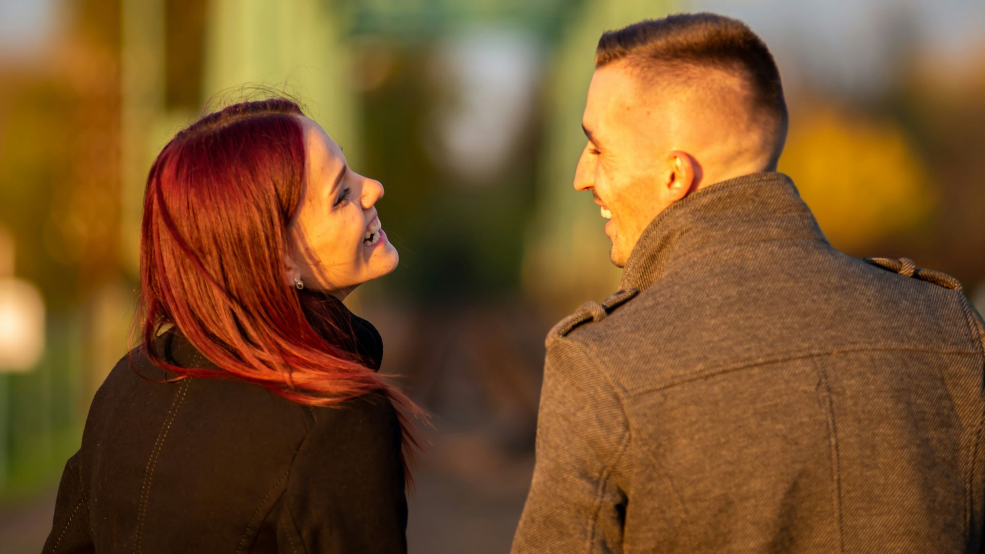 man and woman standing side by side during daytime
