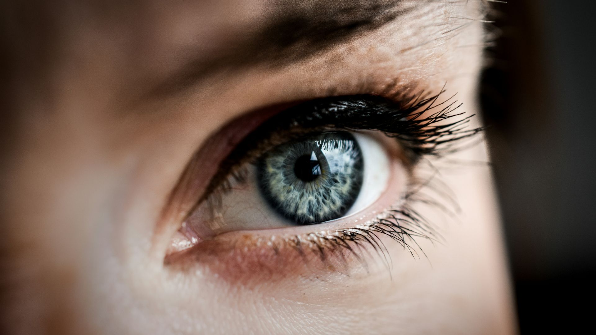 persons eye in close up photography