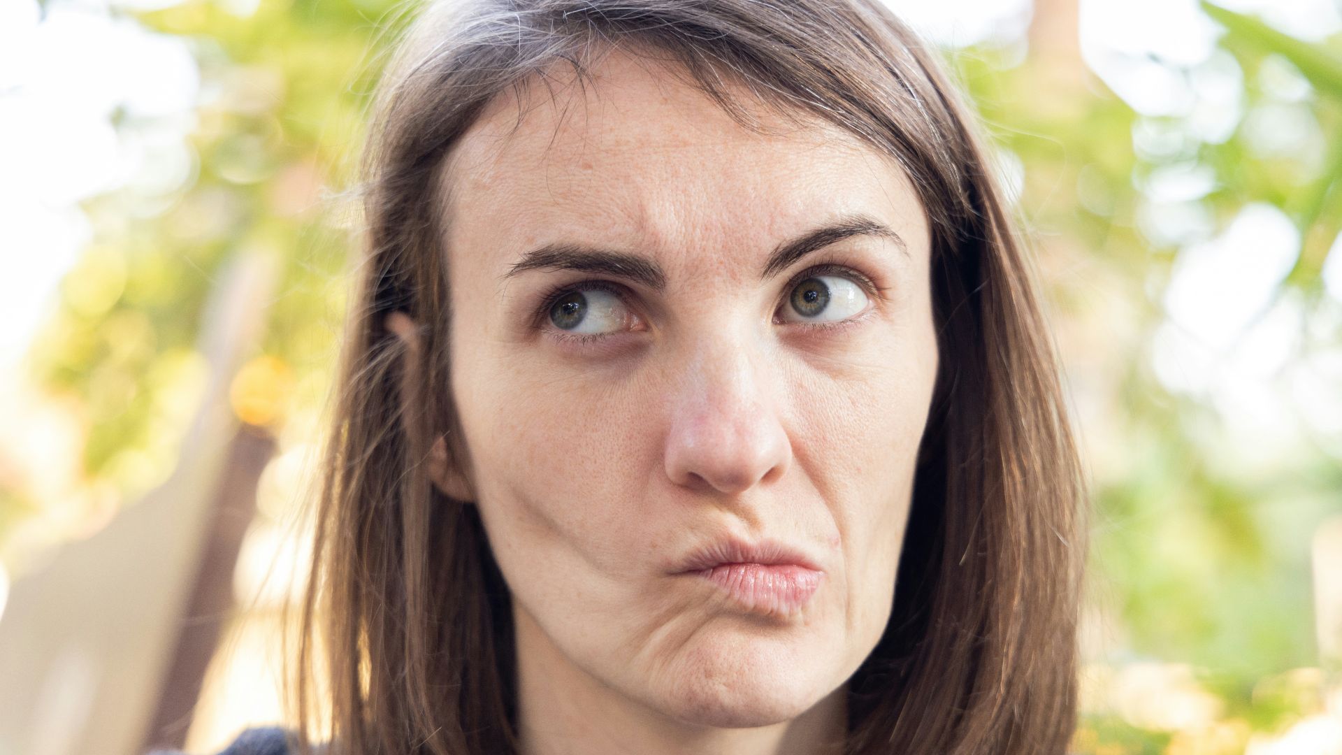 a close up of a person with a surprised look on their face