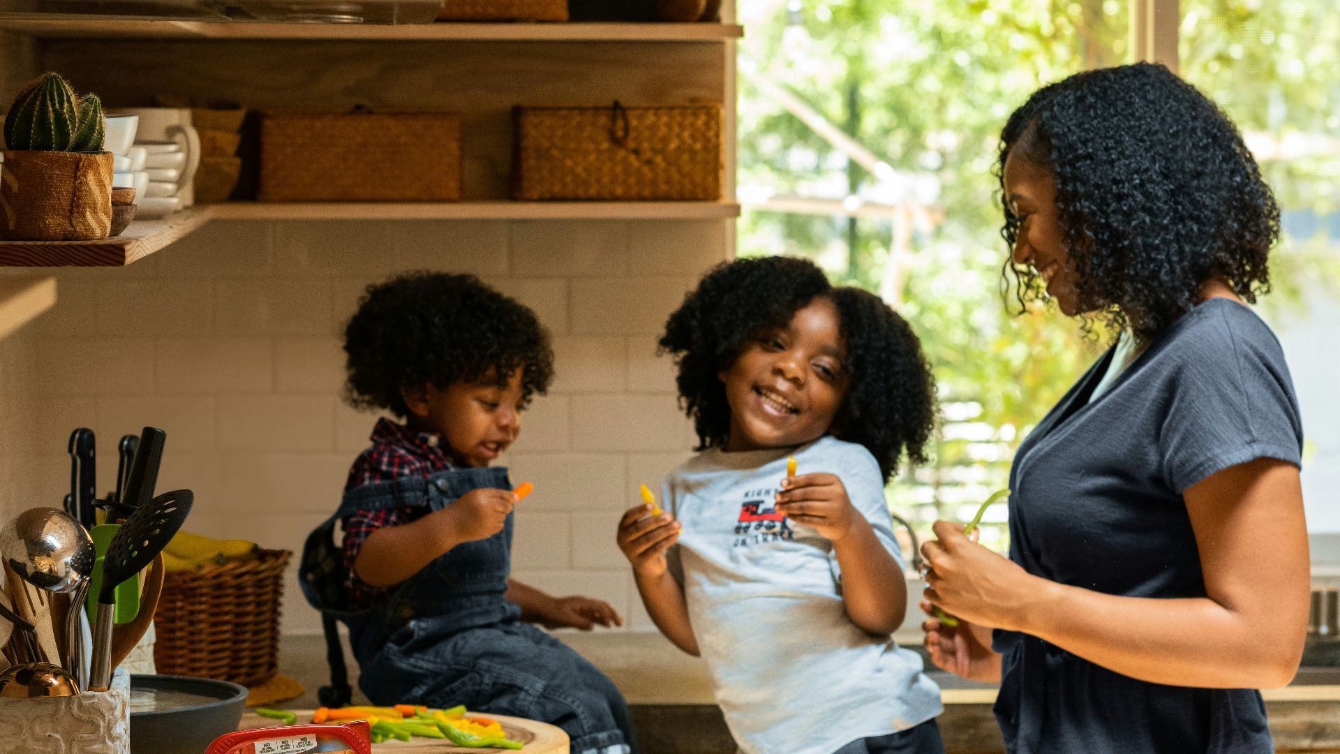 woman in white t-shirt standing beside woman in black and white stripe shirt