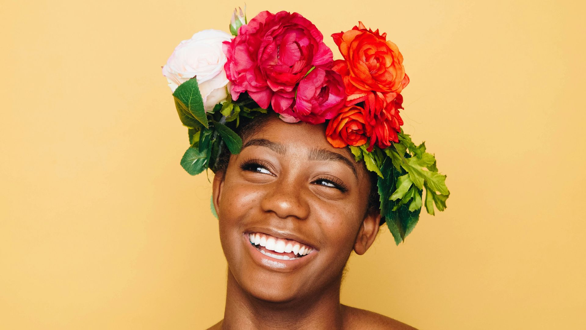 woman smiling wearing flower crown