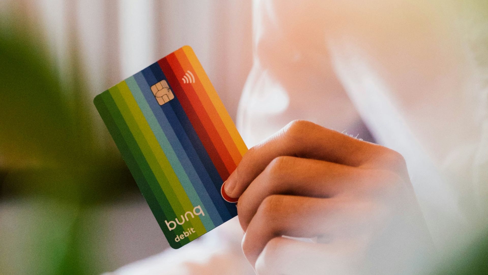 selective focus photography of person holding SIM card