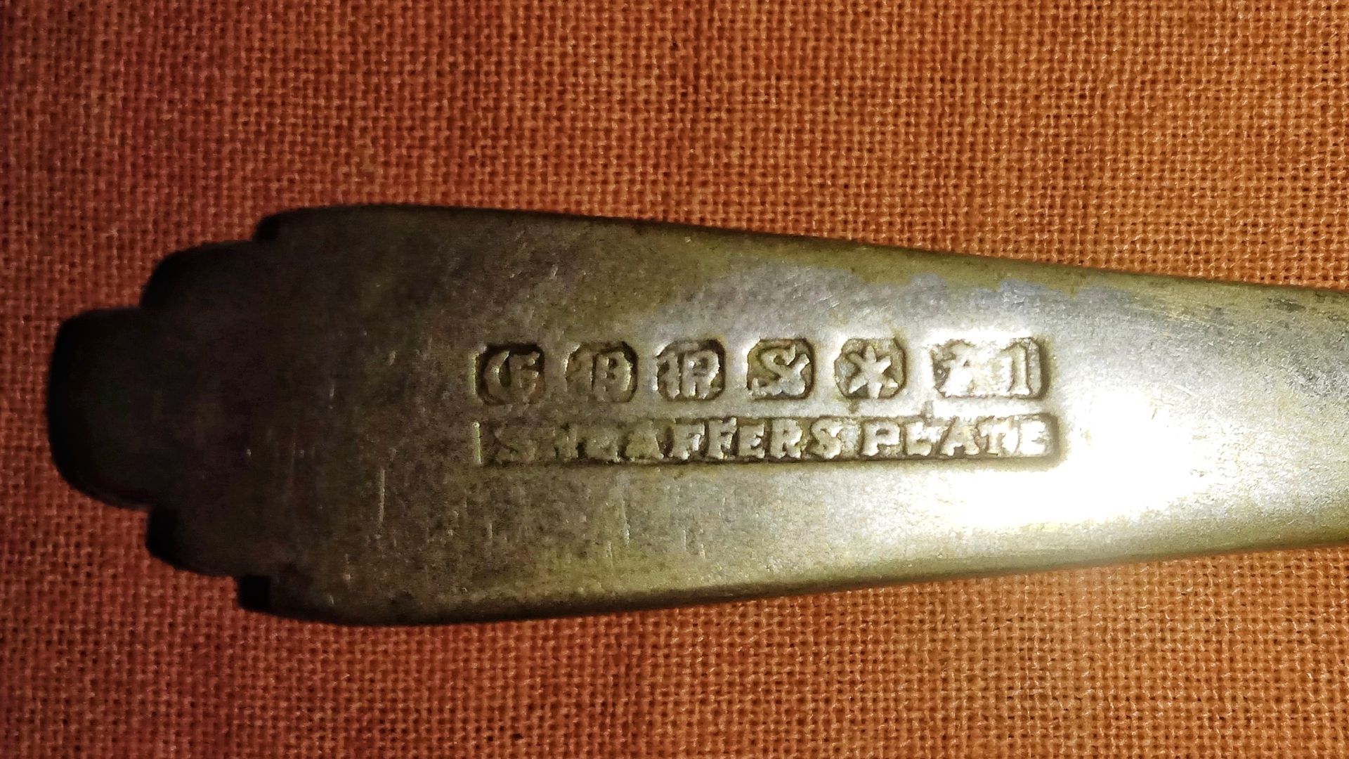 File:Closeup view of the hallmarks in an antique silver spoon from Colonial era, photographed in West Bengal, India, December 7, 2023.jpg
