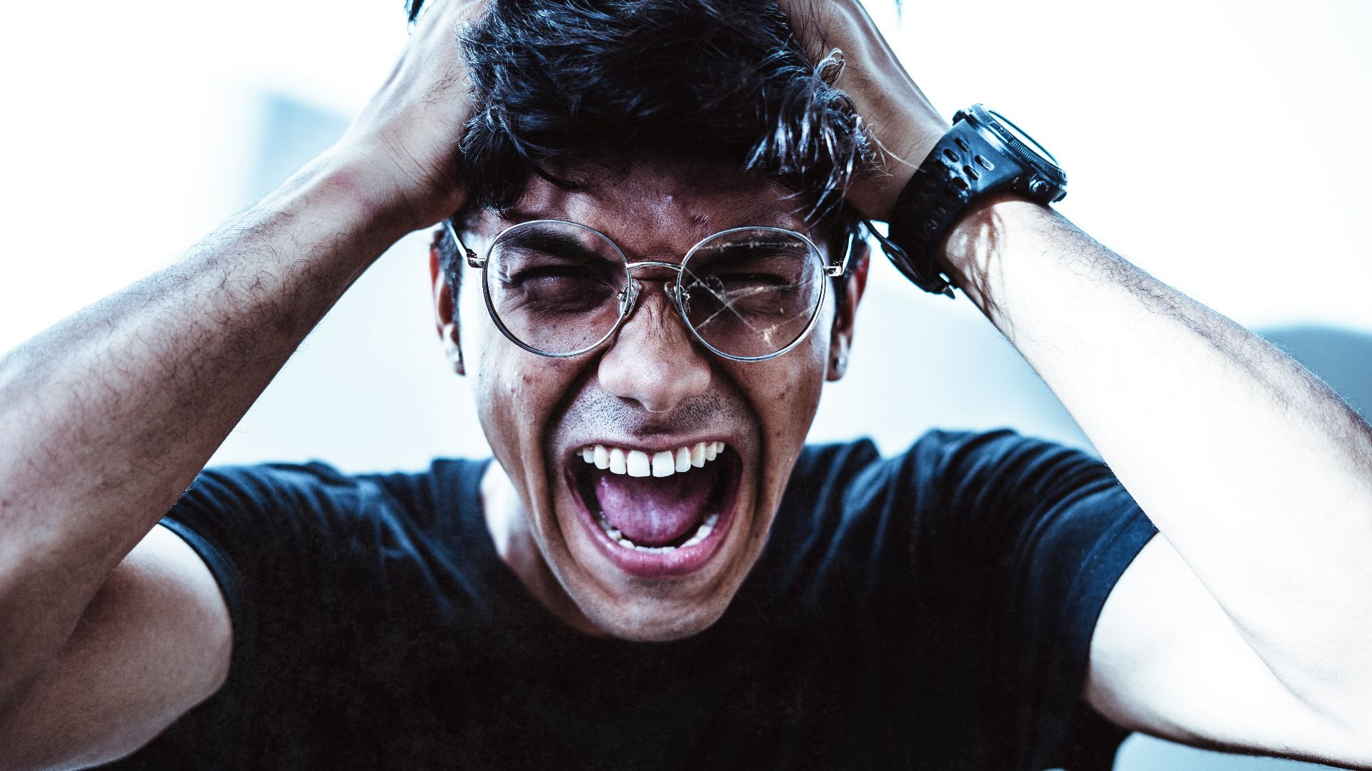 man in black crew neck t-shirt smiling