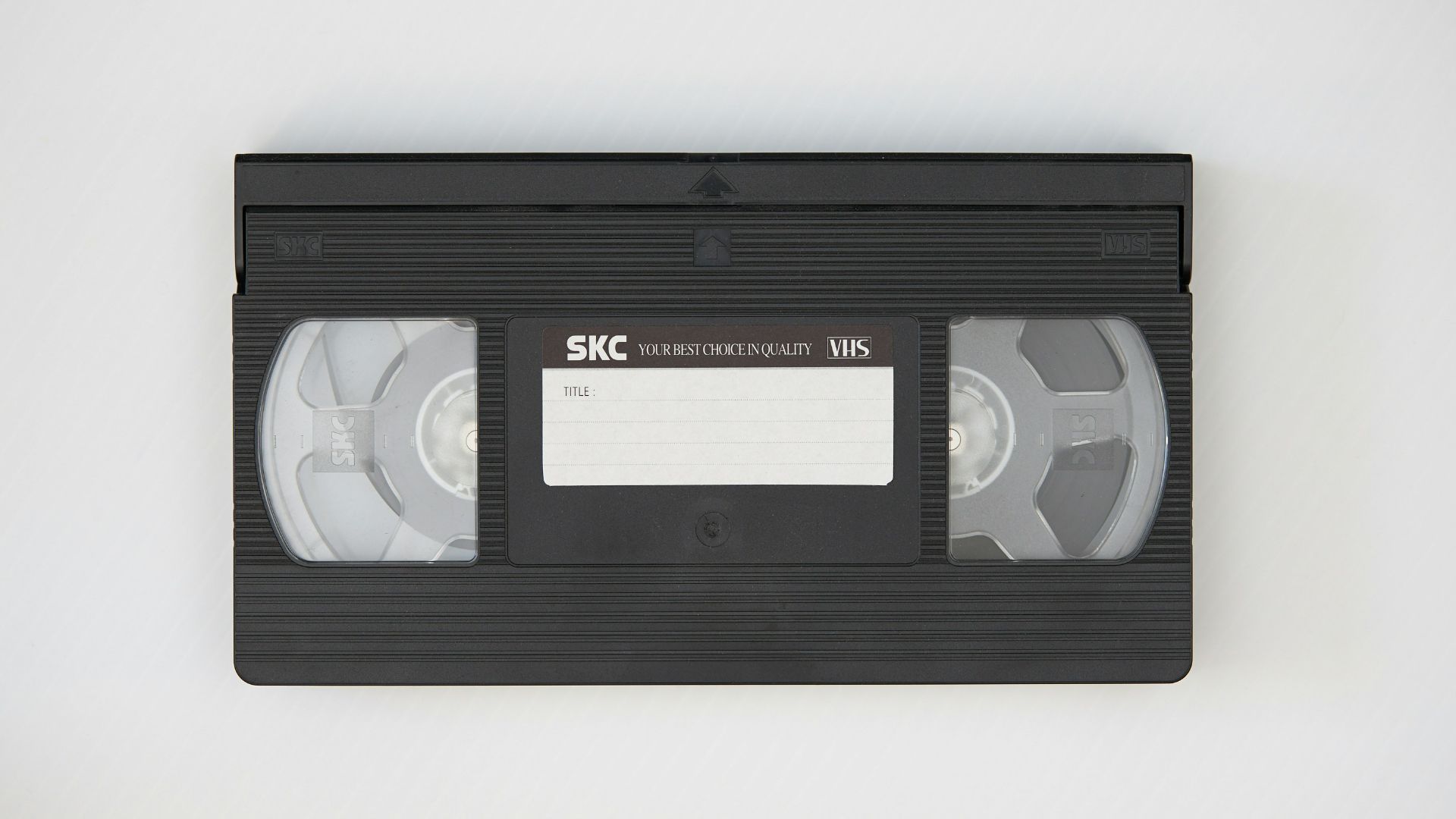 black cassette tape on white textile