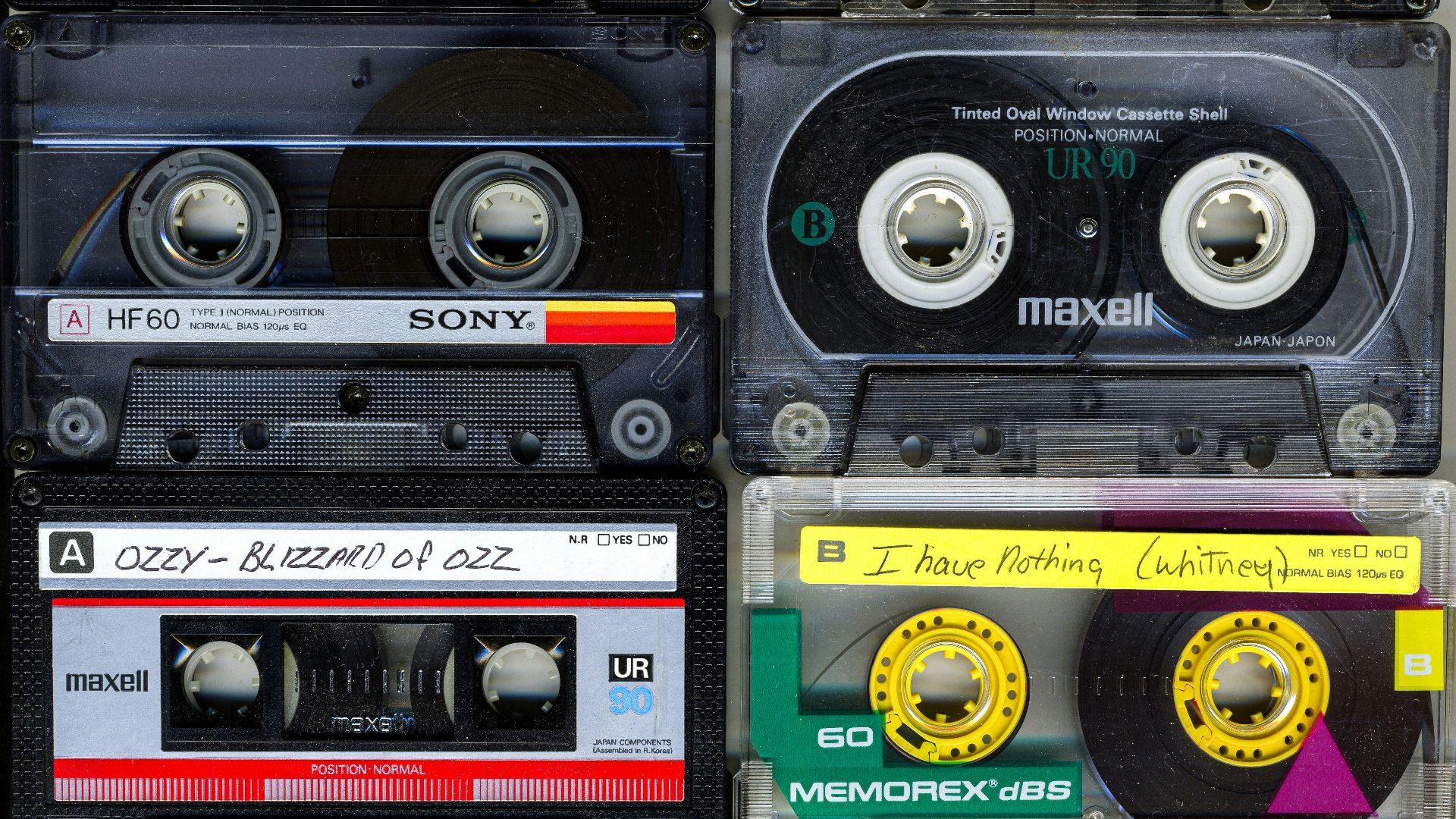 a collection of cassette tapes stacked on top of each other