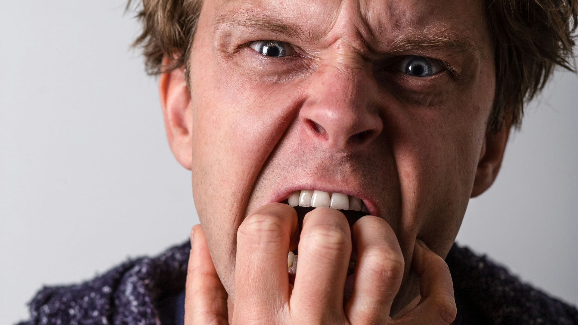 man in blue and white long sleeve shirt
