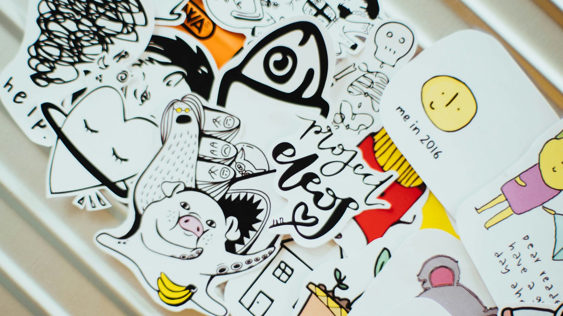 assorted paper dolls on white surface