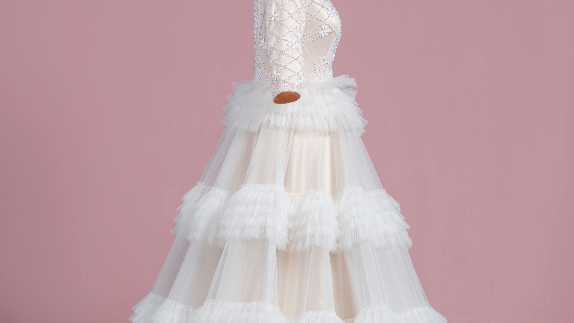 a white wedding dress on a mannequin