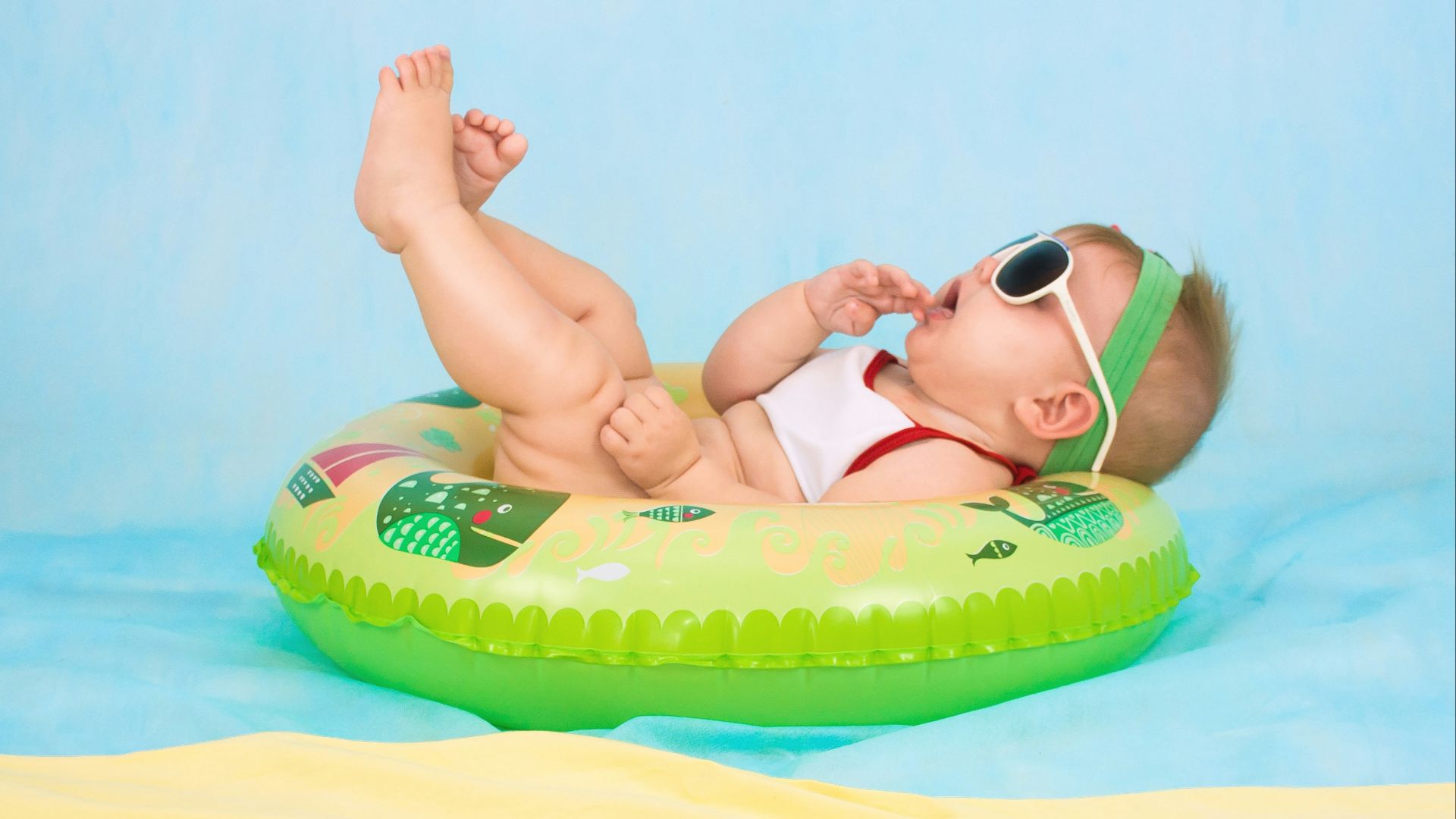 baby lying on inflatable ring