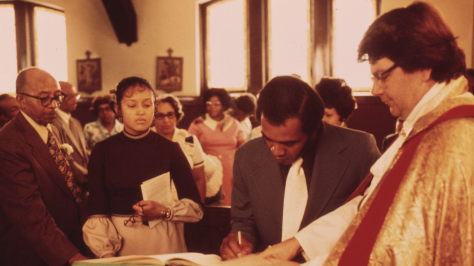 File:BLACK FAMILY SIGNING THE CHURCH REGISTRY AT THE CHURCH OF THE MESSIAH AFTER THE BAPTISM OF BABIES IN THE... - NARA - 556234.jpg