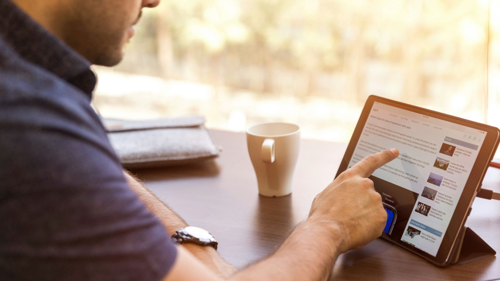 man holding tablet computer