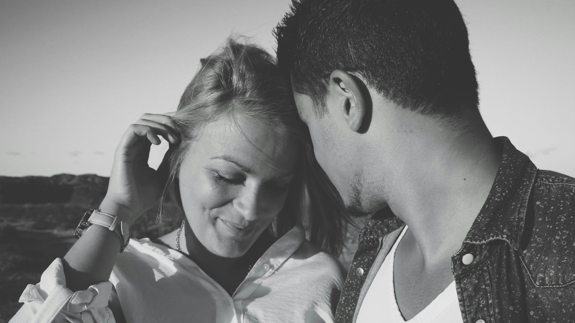 grayscale photography of man and woman