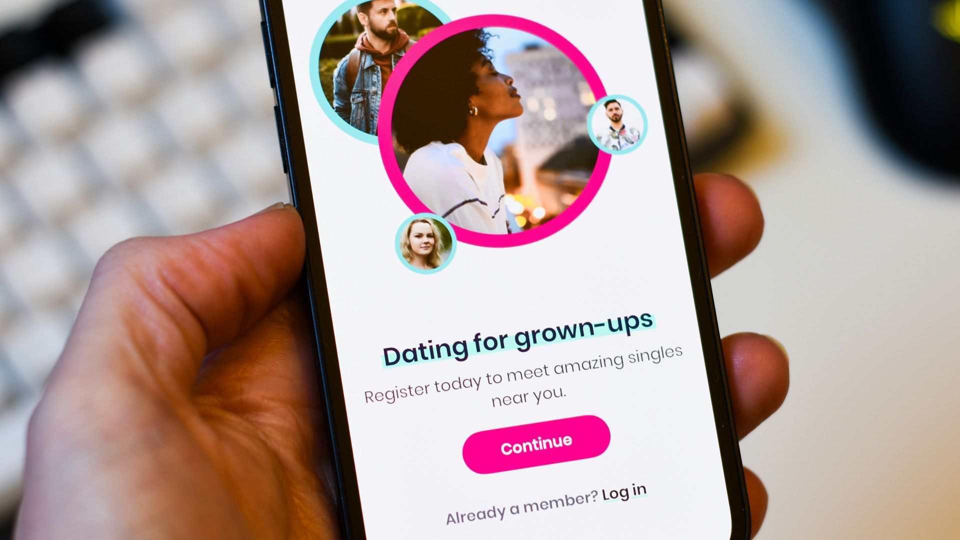 a person holding a cell phone in their hand