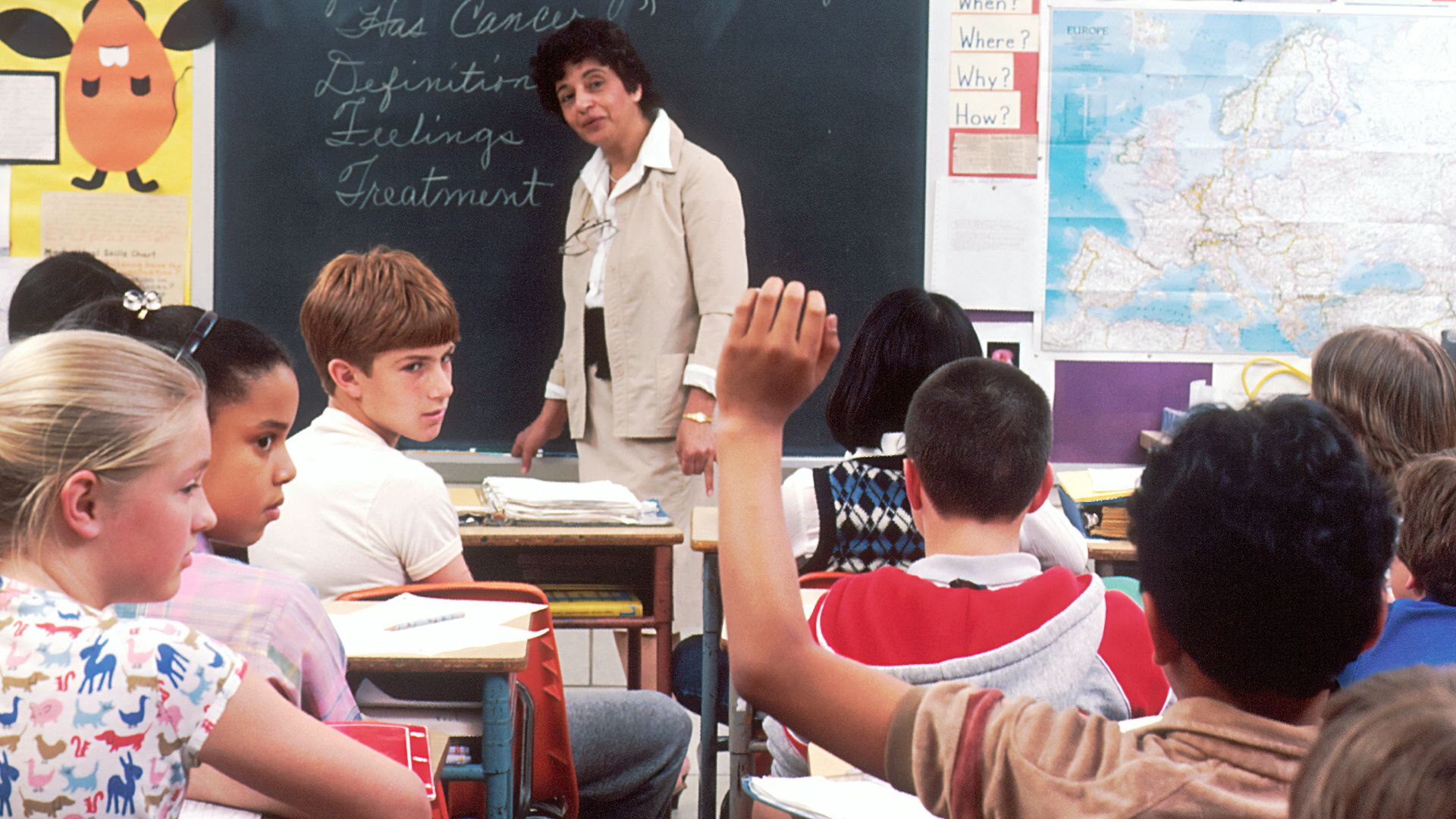 woman standing in front of children