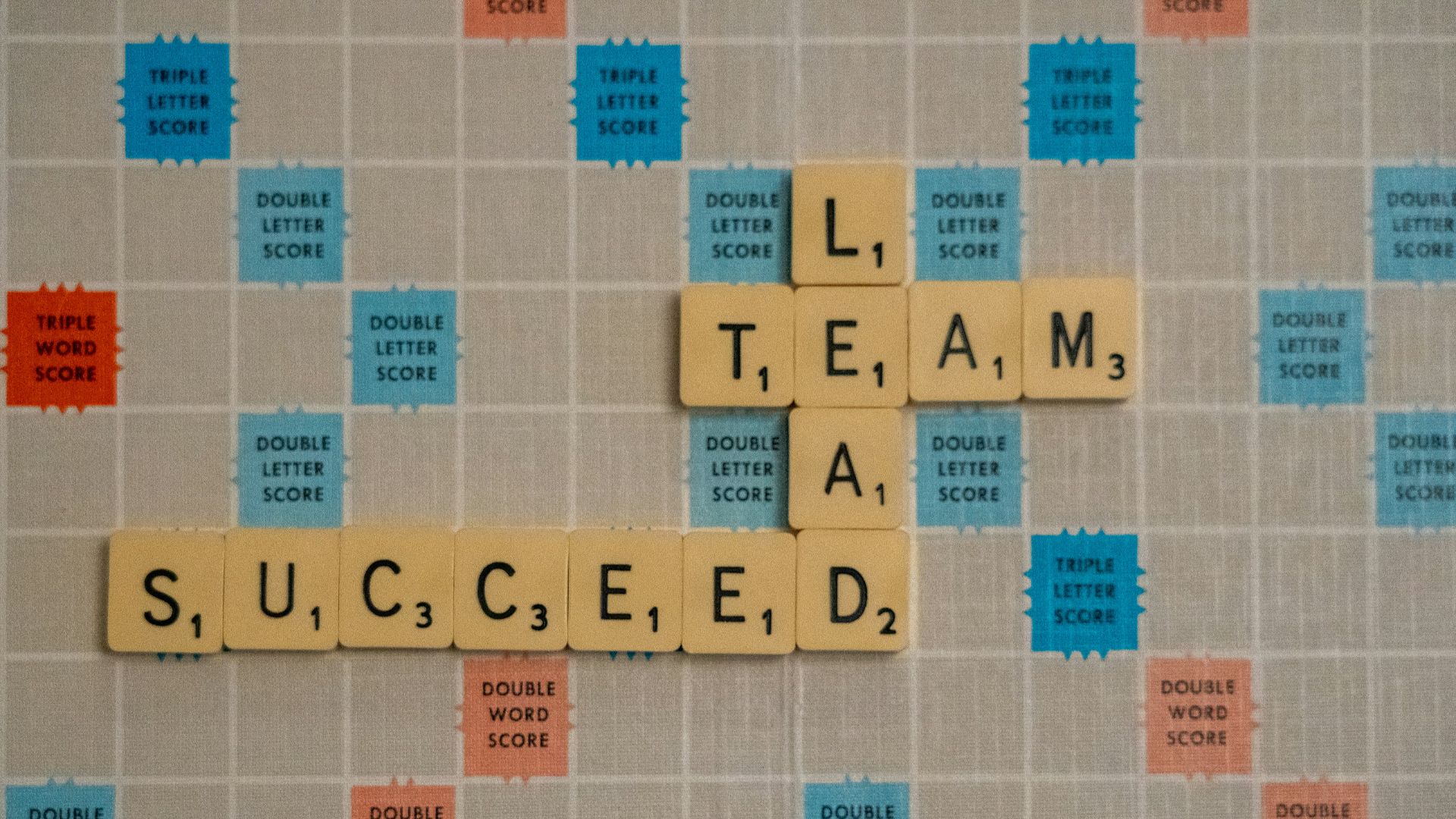 scrabbled scrabble tiles with words on them