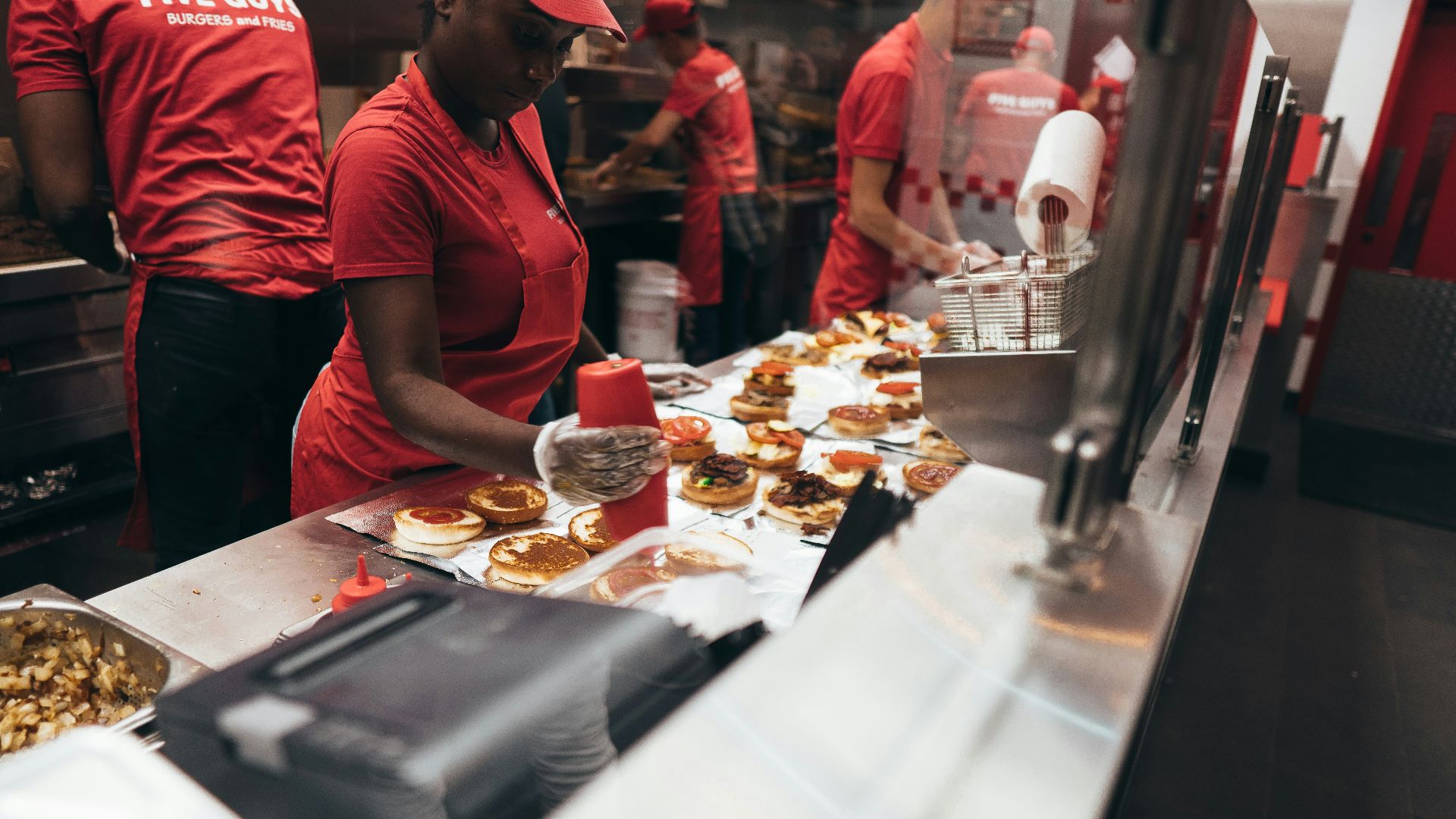 woman preparing a food over the counter