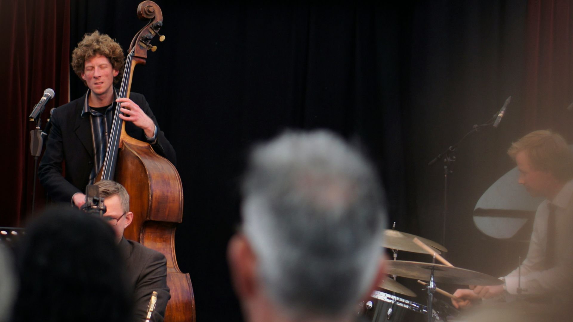 Jazz Club stage with man performing