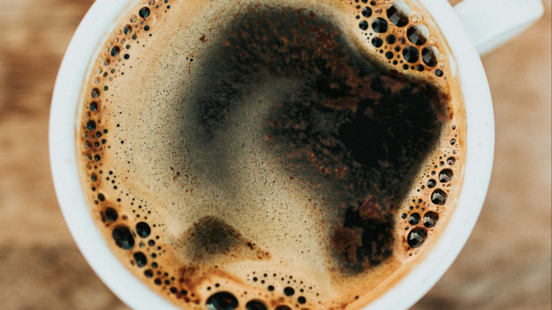 white ceramic mug filled with coffee