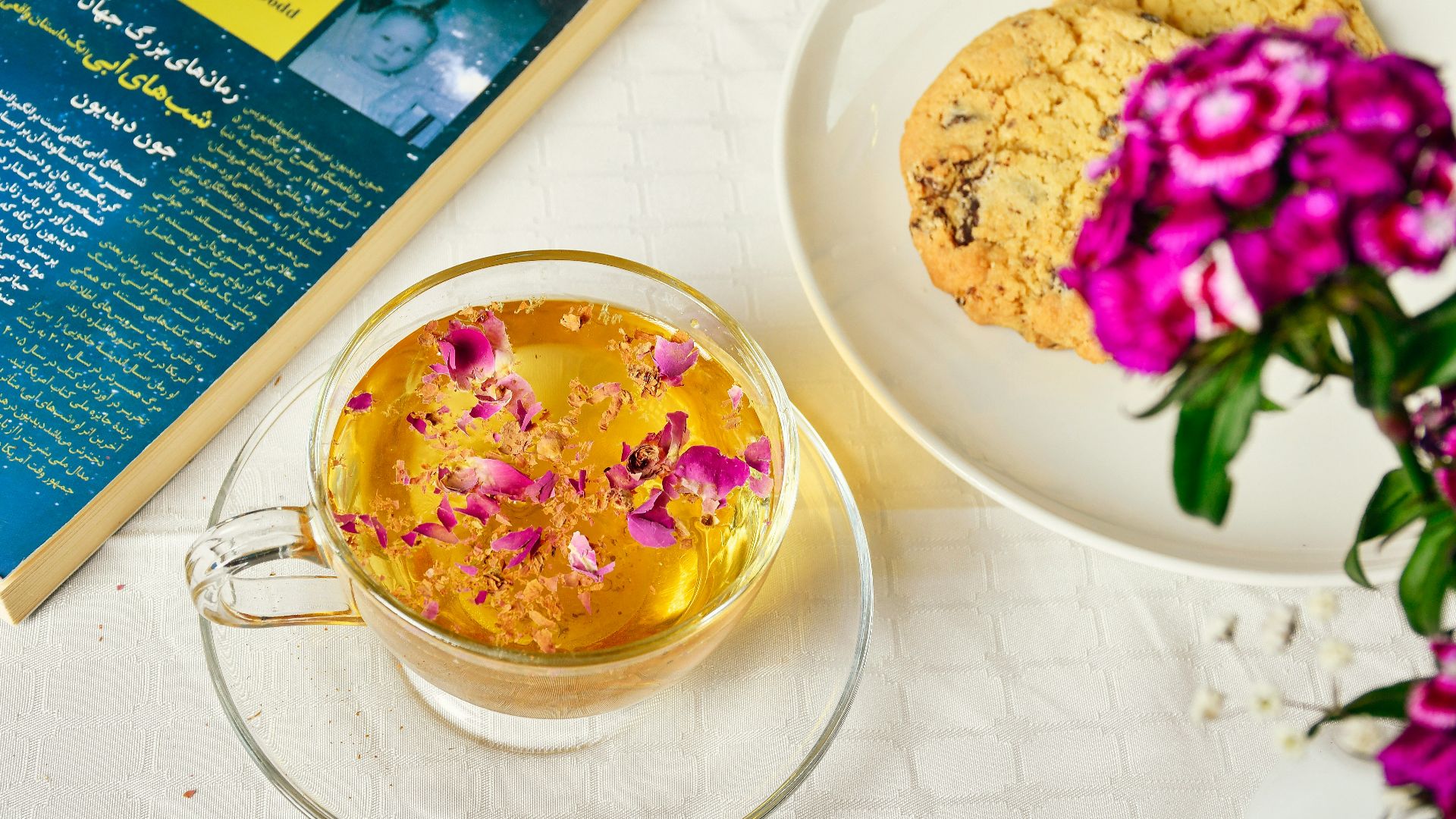 a bowl of food next to a flower