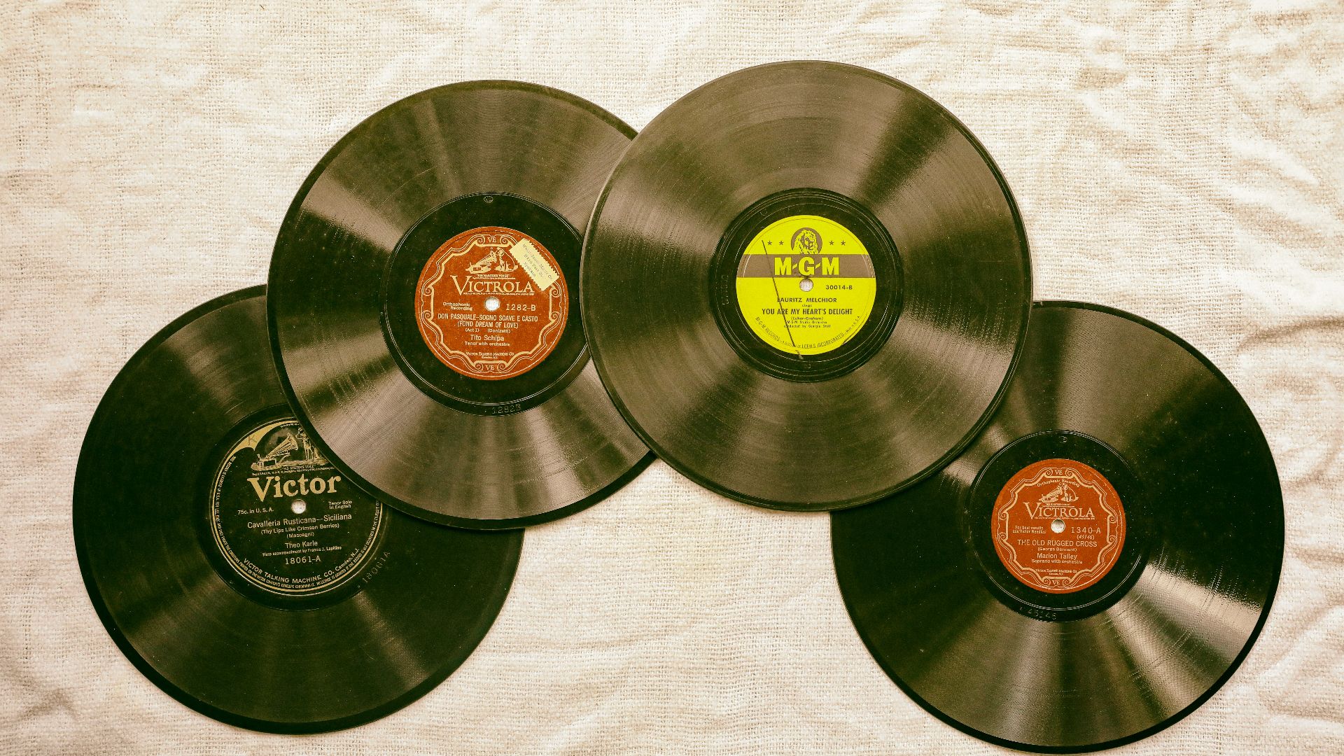 black vinyl record on white textile