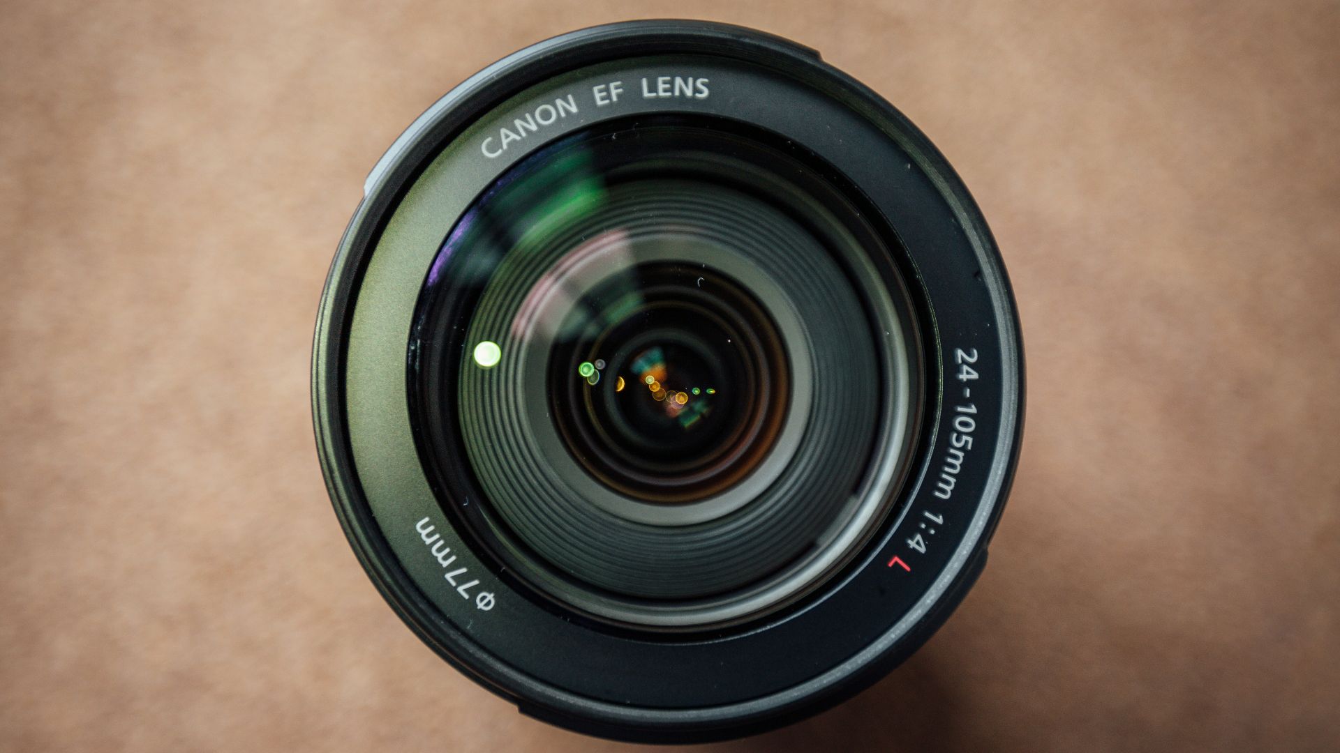 black camera lens on brown wooden table