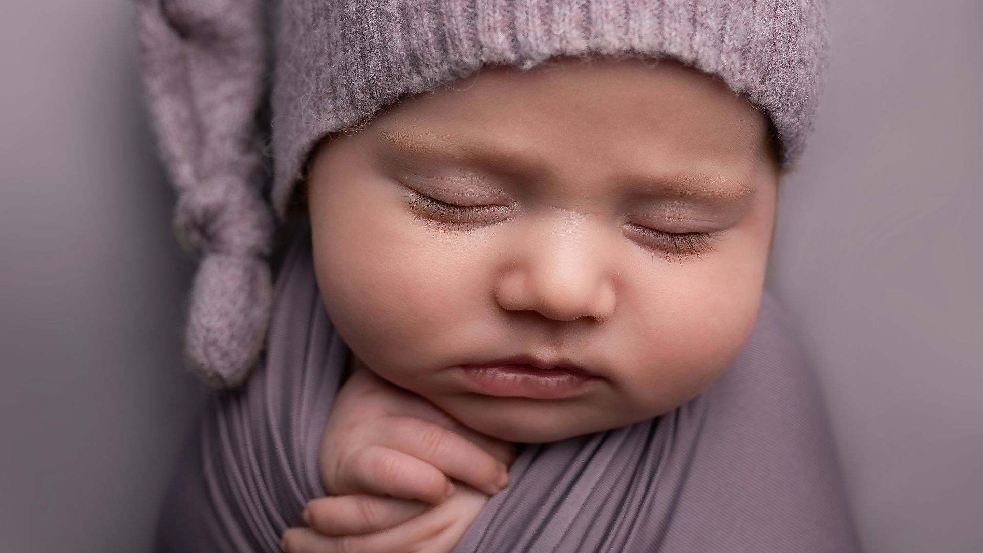 child in gray knit cap