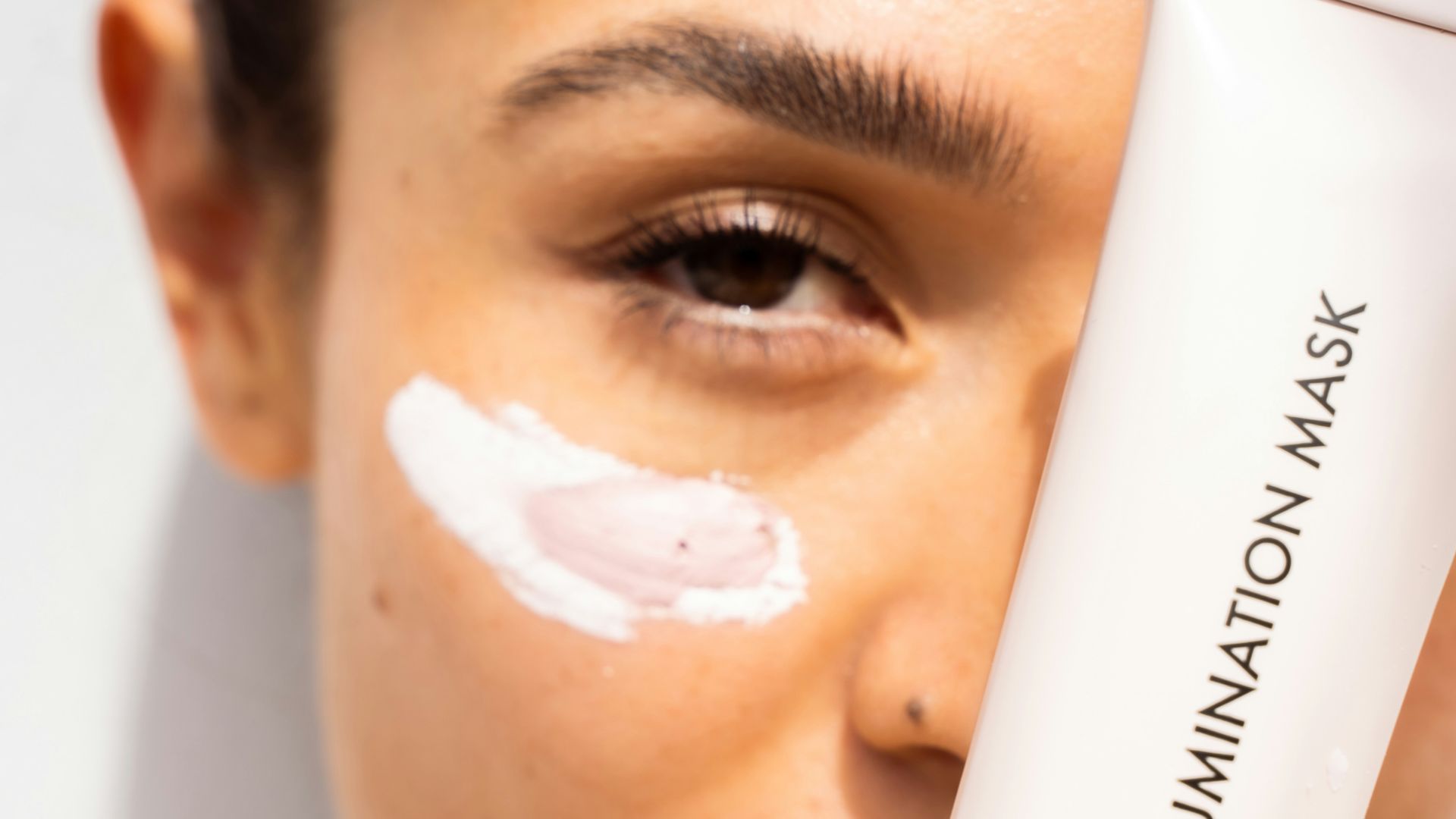 woman with white cream on face