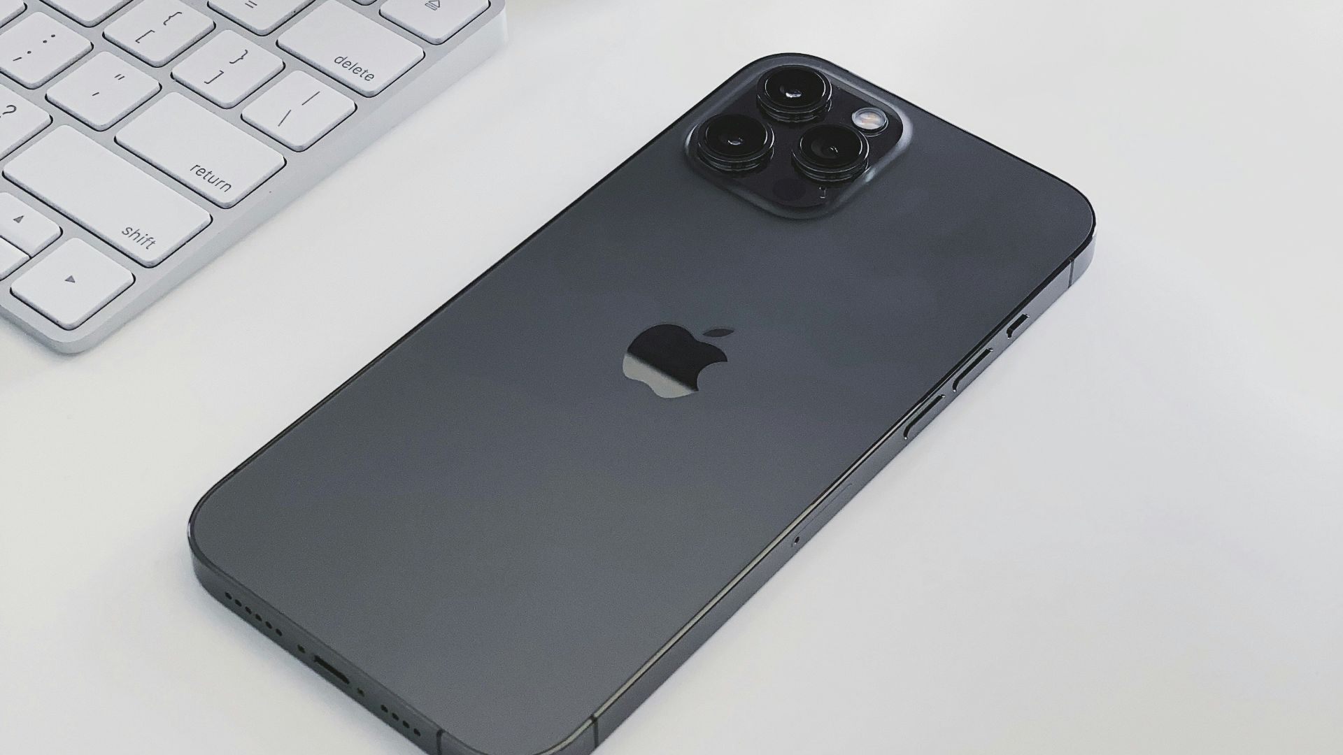 silver iphone 6 on white table