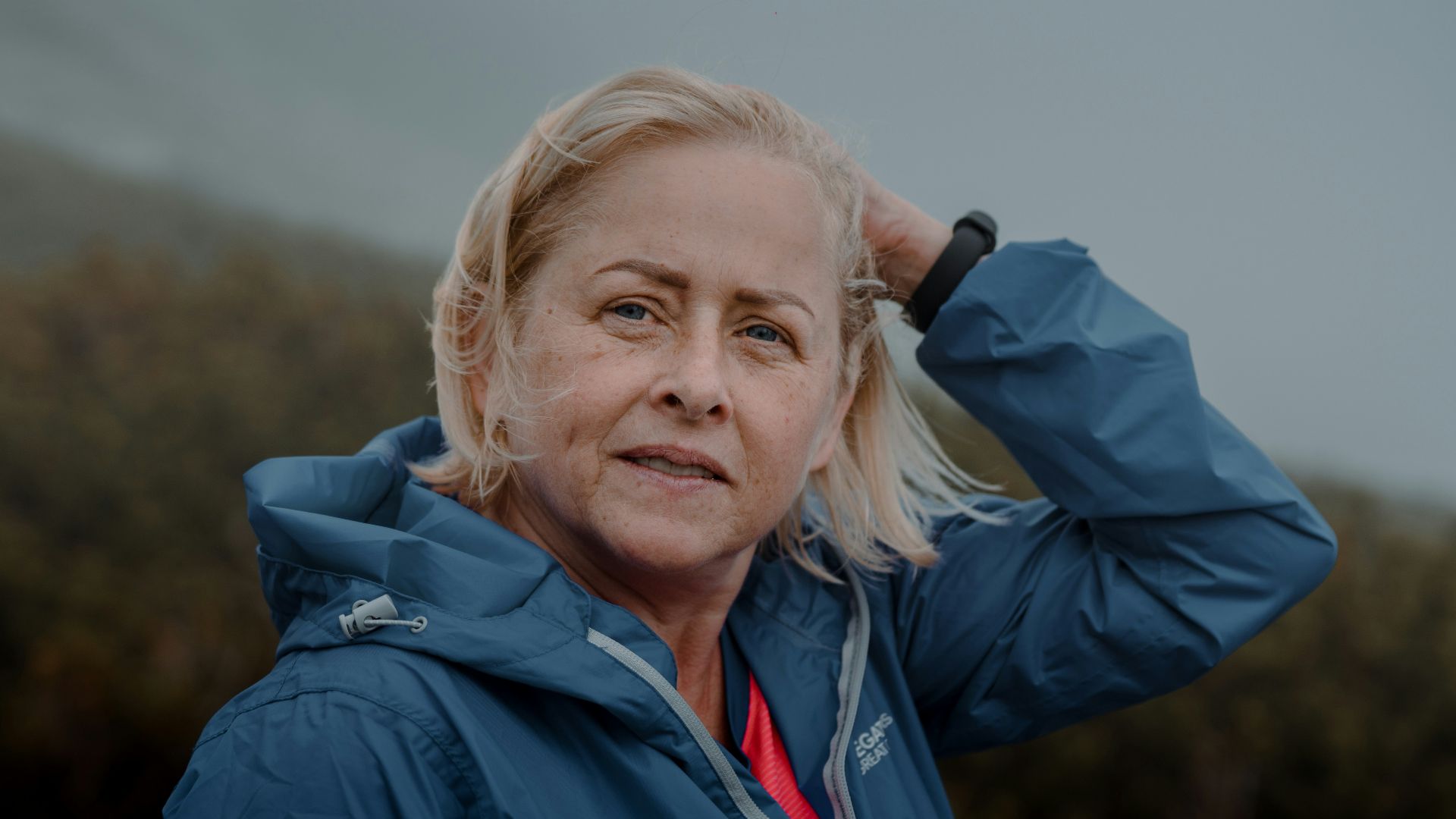 woman in blue jacket smiling