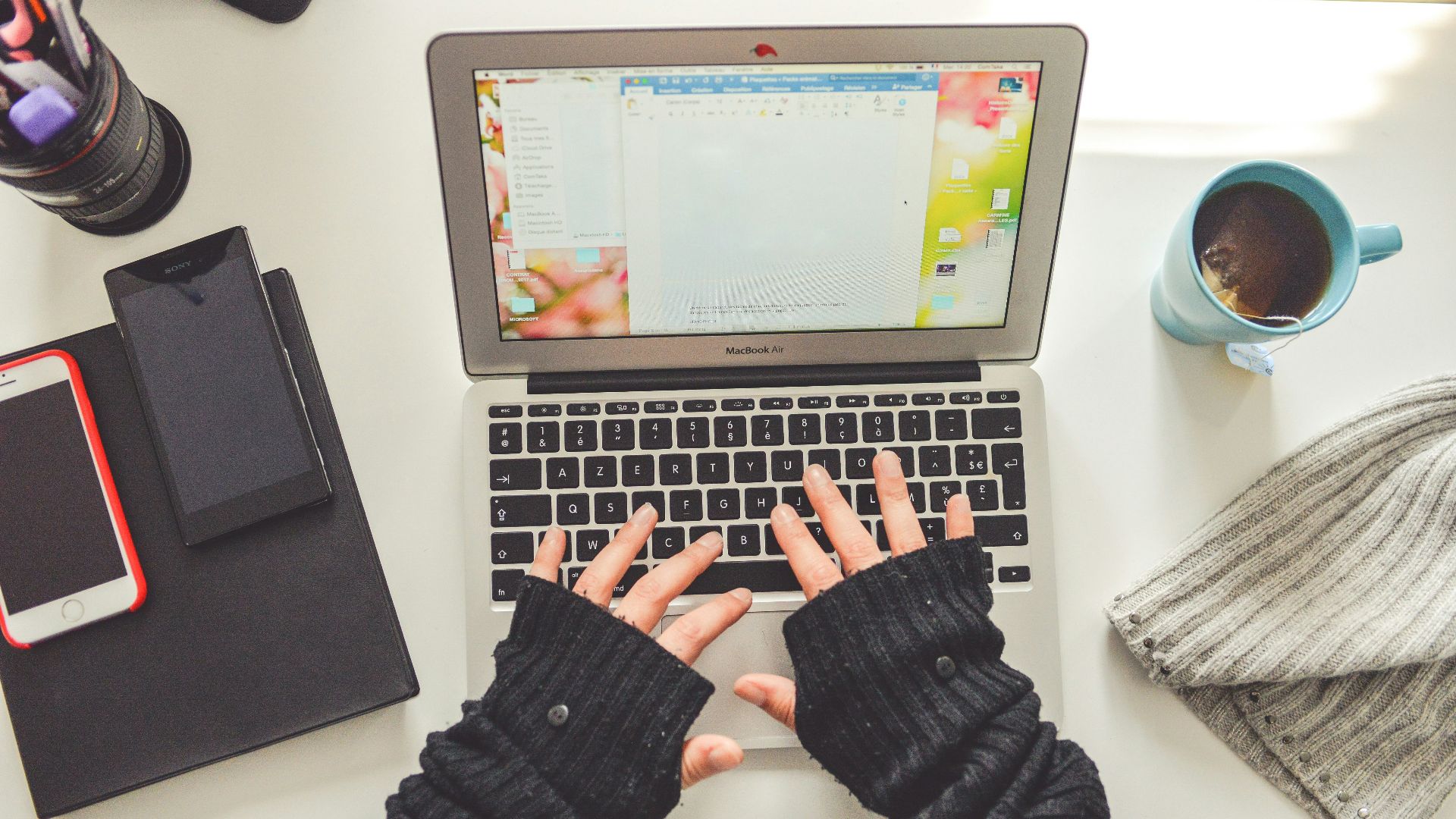 person in black long sleeve shirt using macbook pro
