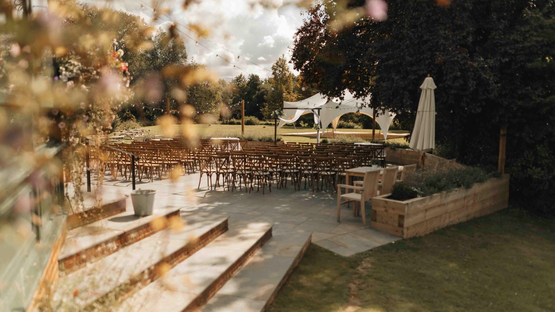 A view of an outdoor wedding venue from a window