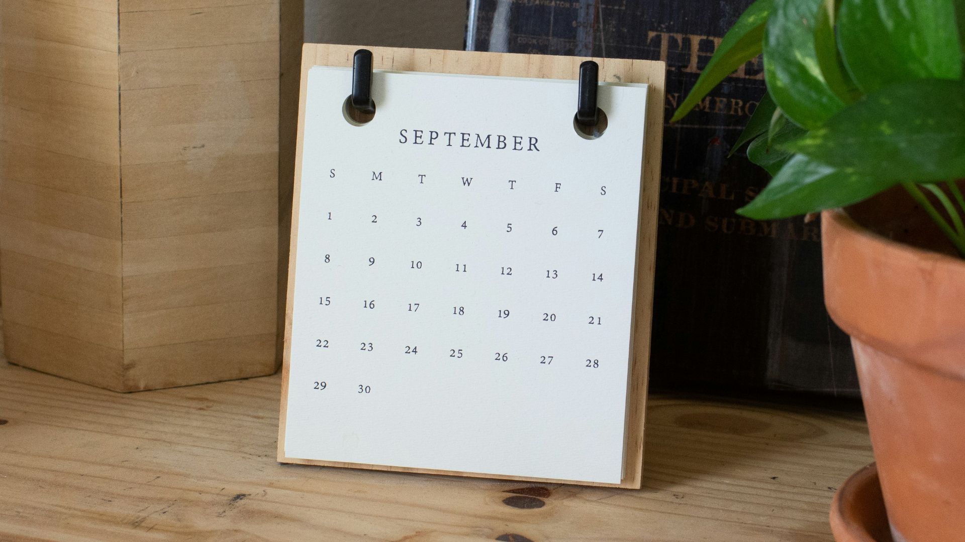 white braille paper on brown wooden table